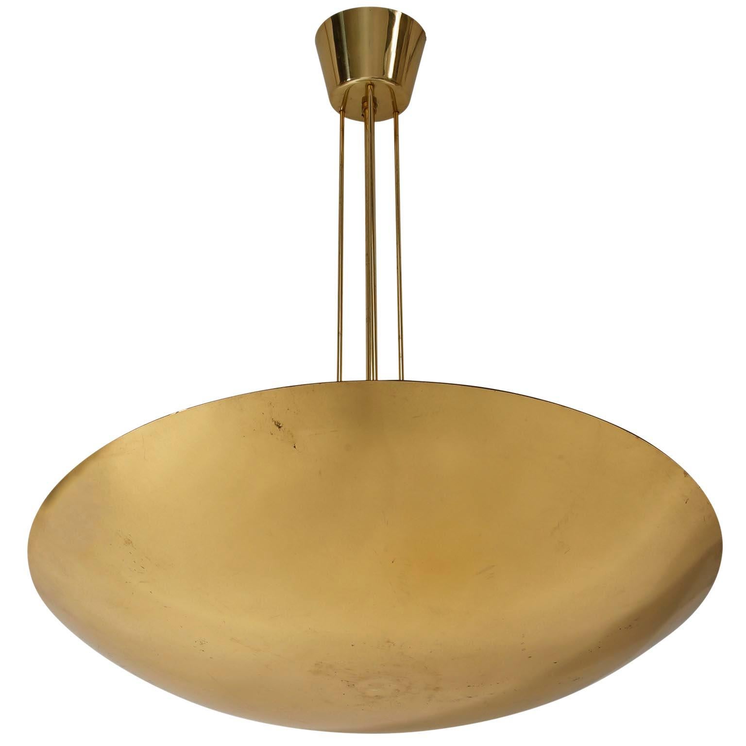 A polished brass bowl up light chandelier / pendant light by J.T. Kalmar, Austria, manufactured in midcentury, circa 1970 (late 1960s or early 1970s).
This uplighter has three sockets for medium screw base bulbs. It works well in US, Europe, Asia,