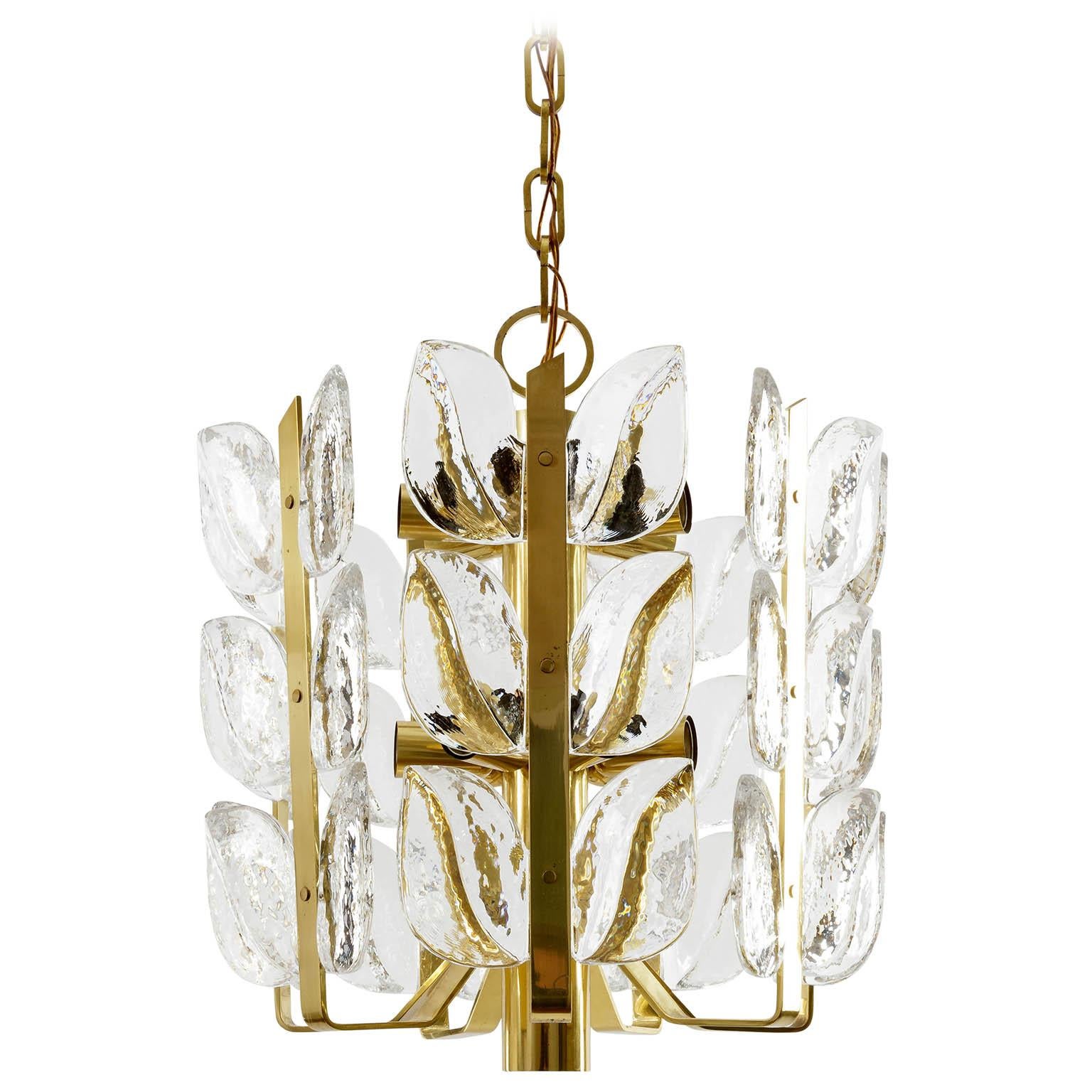 A beautiful and handmade high quality light fixture model 'Florida' by J.T. Kalmar, Austria, manufactured in midcentury, circa 1970 (late 1960s or early 1970s).
The lamp is made of polished brass and large fire-polished brilliant crystal glasses in