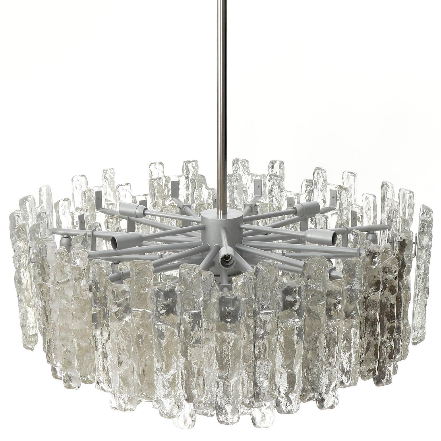 One of three extra large light fixtures model 'Soria' by Kalmar, Austria, manufactured in midcentury, circa 1970 (late 1960s or early 1970s). 
The offered chandeliers are the largest version of the 'Soria' series from Kalmar. They have been