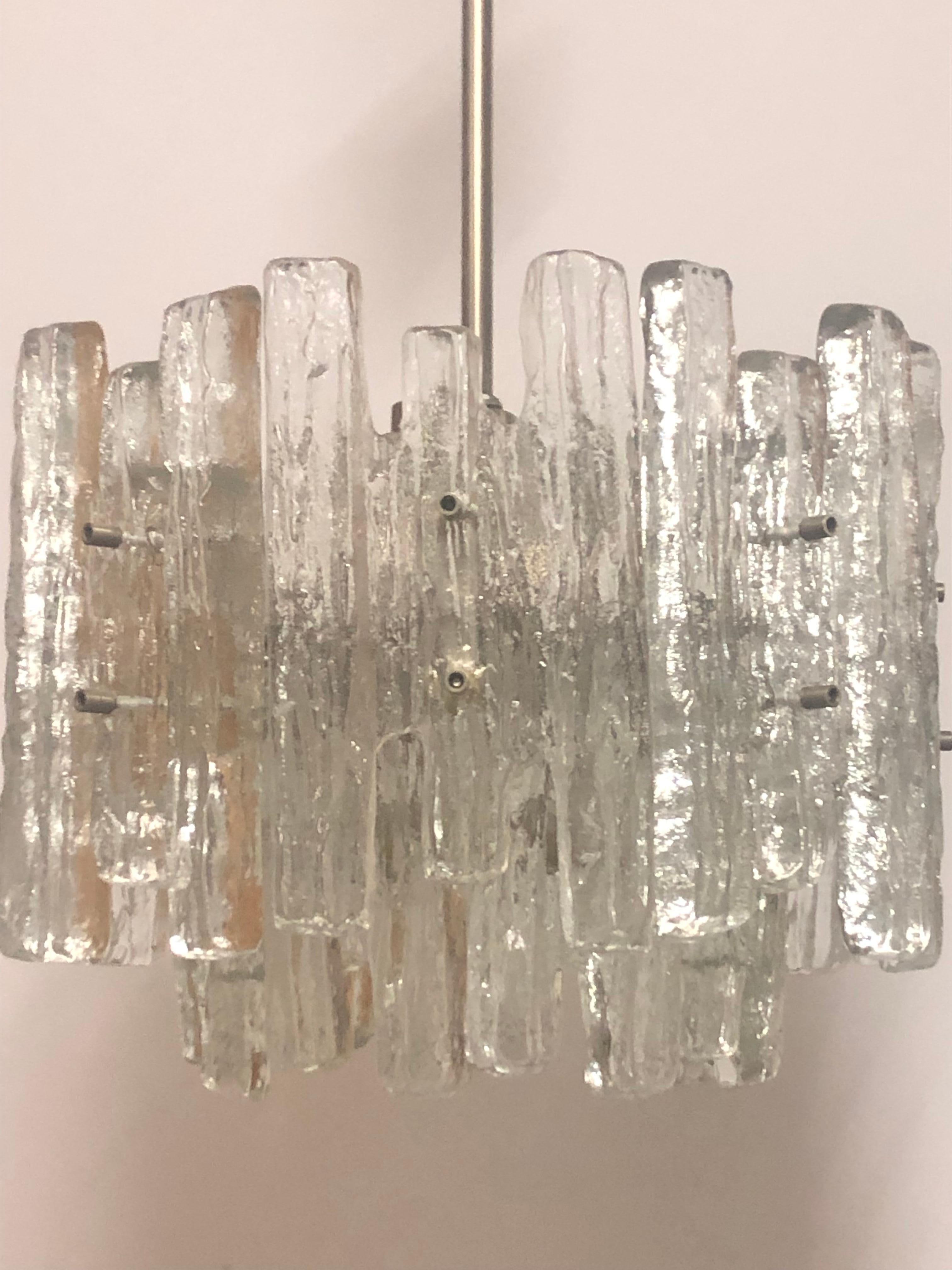 A mid -century modern Ice glass chandelier by J.T.Kalmar, Austria, 1960s.
Made of and Murano glass and nickel frame.
