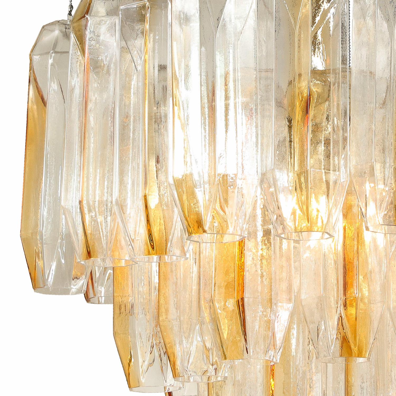 Remarkable clear and amber shaped glass chandelier with a polished nickel hexagon shape canopy. It was designed by Kalmar Franken, Austria 1960s. The glass pieces were likely made by AV Mazzega in Murano as Kalmar used many Murano glass pieces for