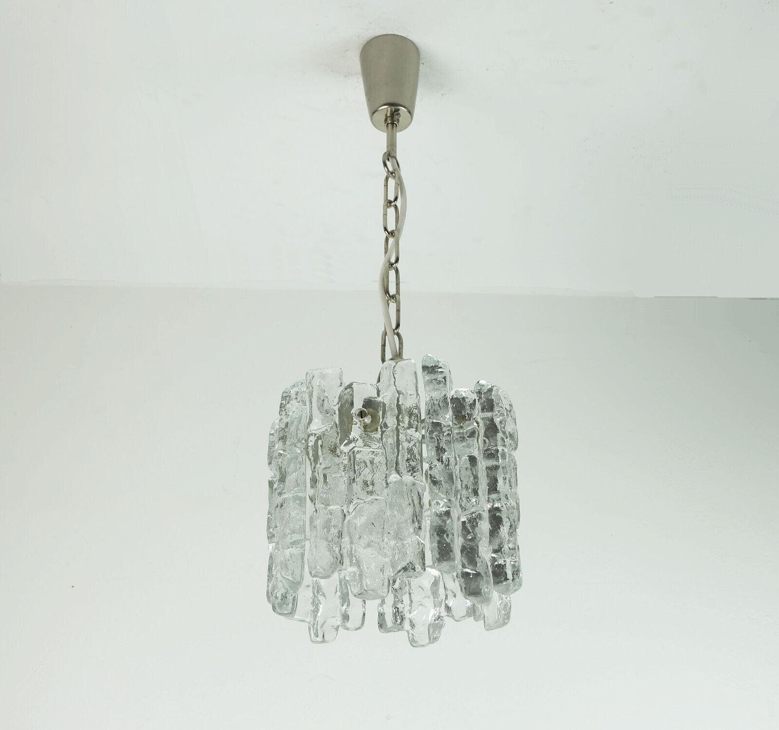 Mid century pendant light manufactured in the 1960s / 70s by Kalmar Franken (model 3379/1, series 1/6/7/8). The shade consists of 6 individual elements made of thick structured glass in an ice look, which are attached to a silver-colored metal