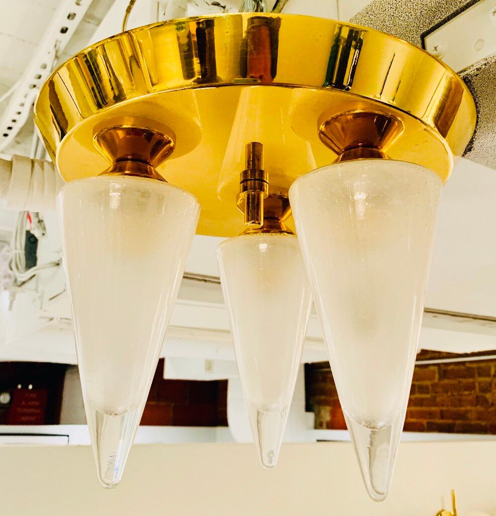 A rare 1970s golden brass Austrian flush ceiling light with three thick bubbled Murano Glass come shades. Newly Rewired.