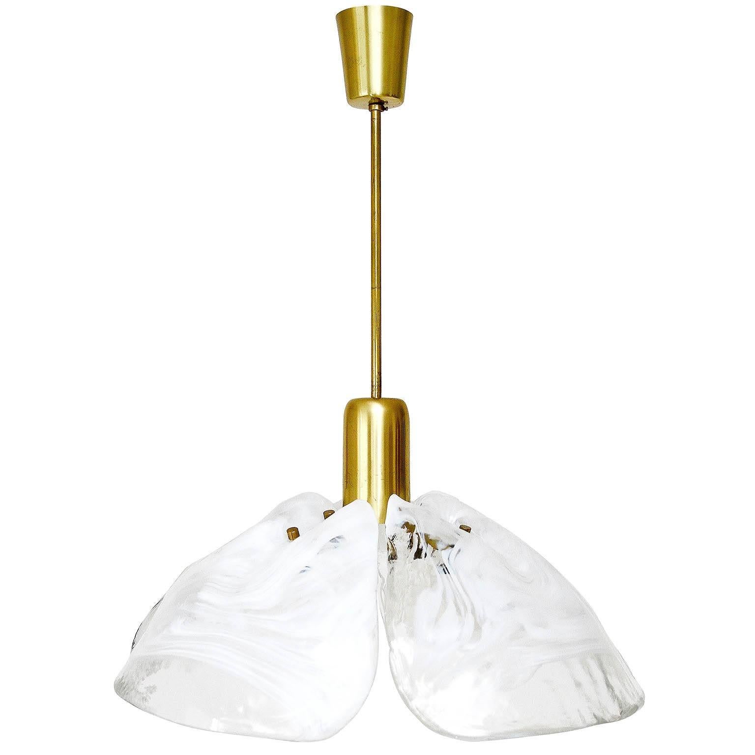 A beautiful floral chandelier made of Murano glass and brass by Kalmar, Austria, circa 1970.
The four hand blown Murano glass pieces consits of white and clear glass. Each glass is unique and a one-of-a-kind piece.
The original canopy can be