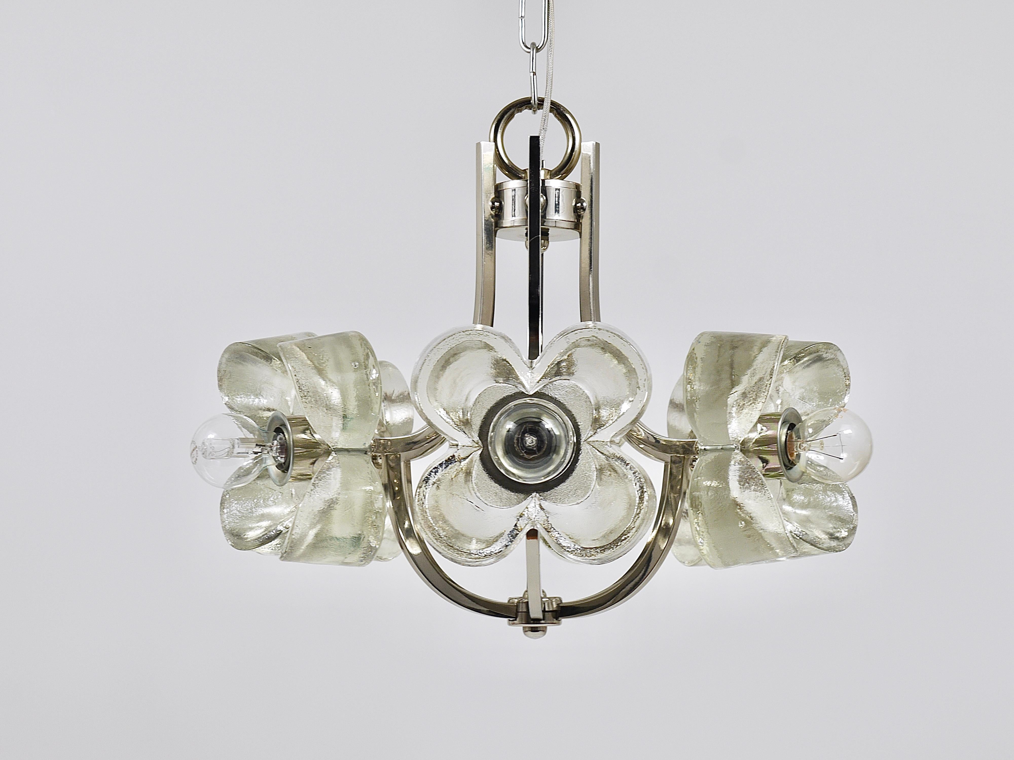 A charming and decorative mid-century brass & glass chandelier / pendant light fixture from the 1970s. Designed and manufactured by Sische / Simon and Schelle in Germany. Consists of a nickel / chrome plated frame with six solid and thick crystal
