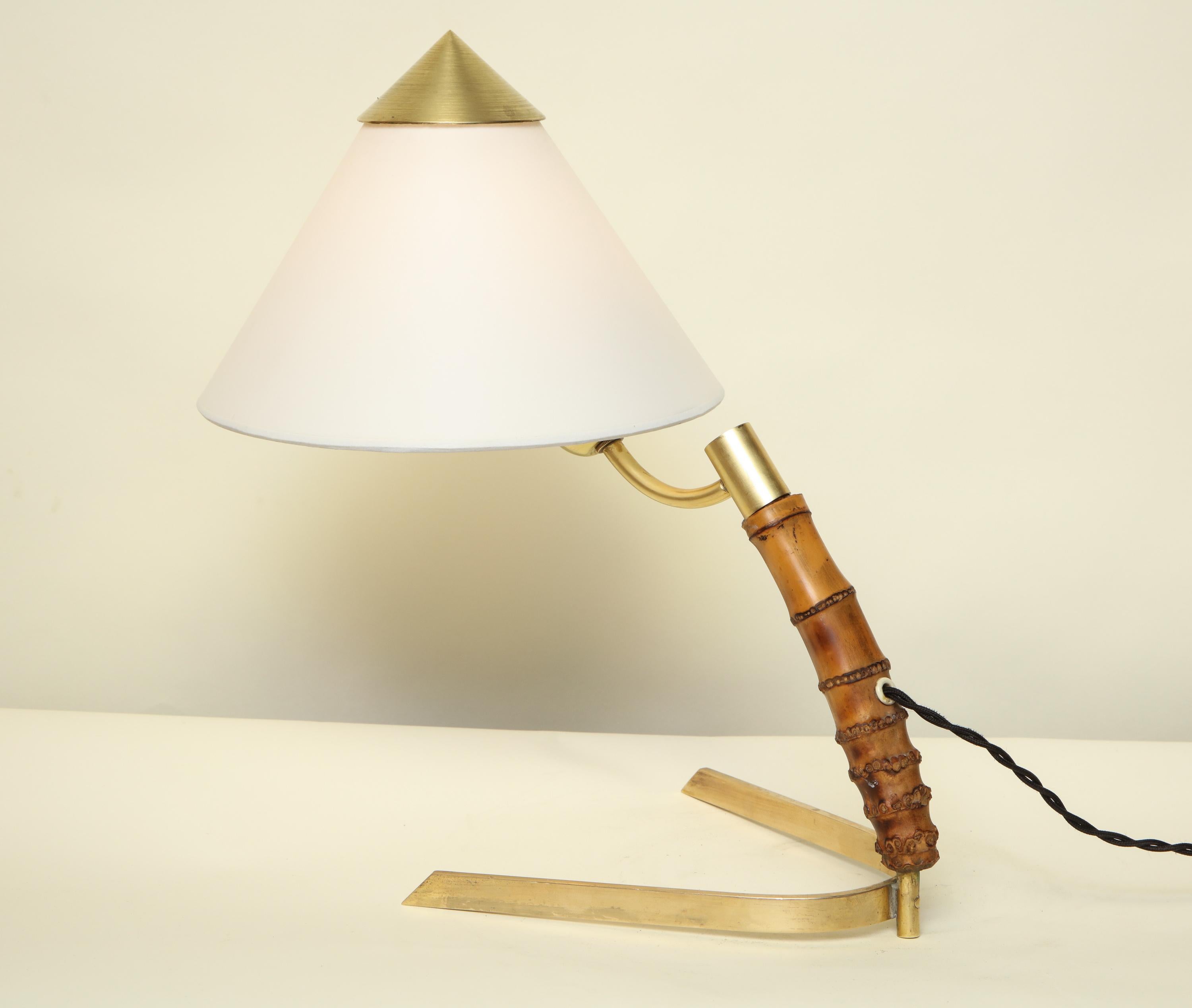 A table lamp by Kalmar Mid-Century Modern crafted of bamboo and brass with parchment paper shade
New socket and rewired.