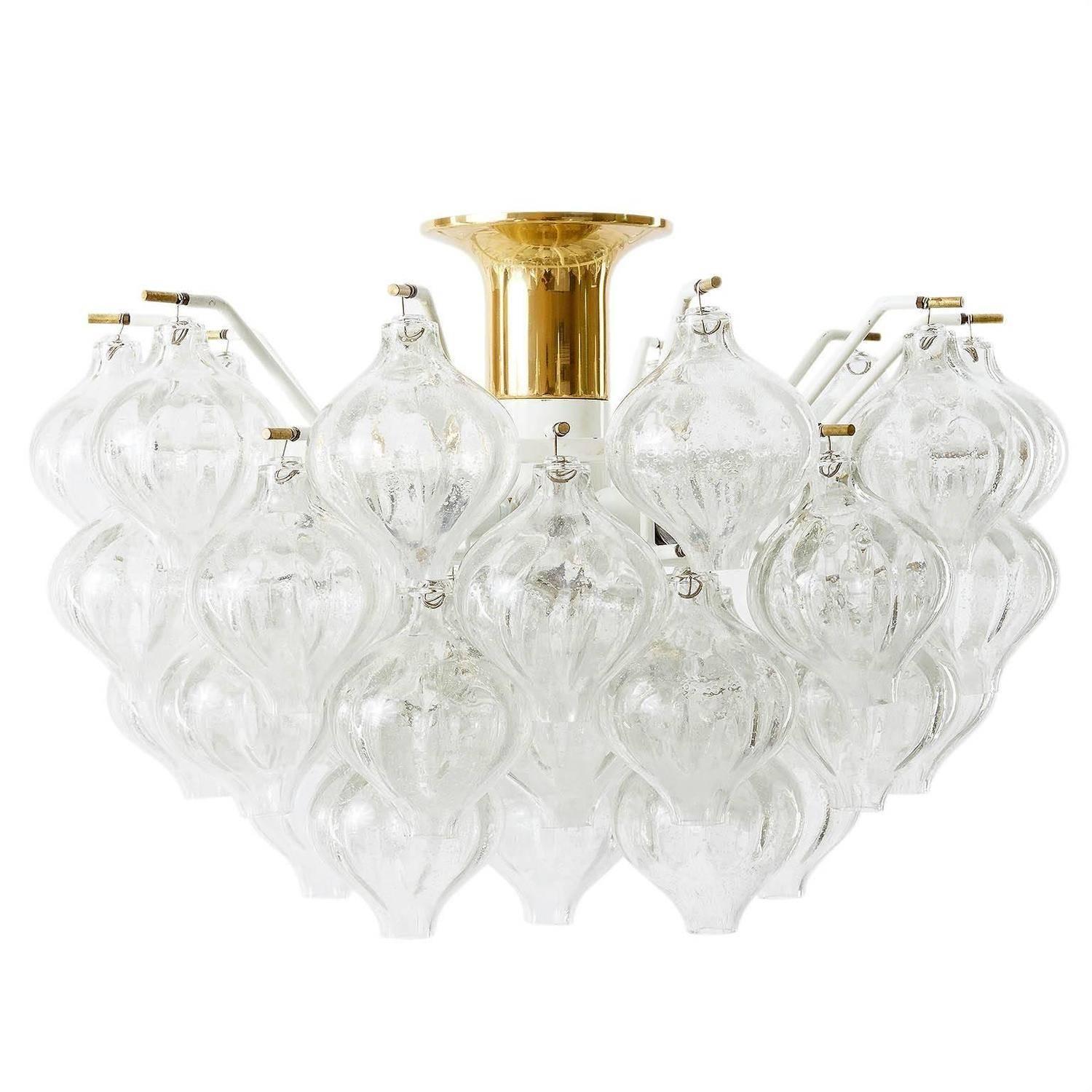 A gorgeous light fixture model Tulipan by J.T. Kalmar, Vienna, Austria, manufactured in midcentury, circa 1970 (late 1960s or early 1970s).
The name Tulipan derives from the tulip shaped handblown bubble glasses. Each glass is handmade and