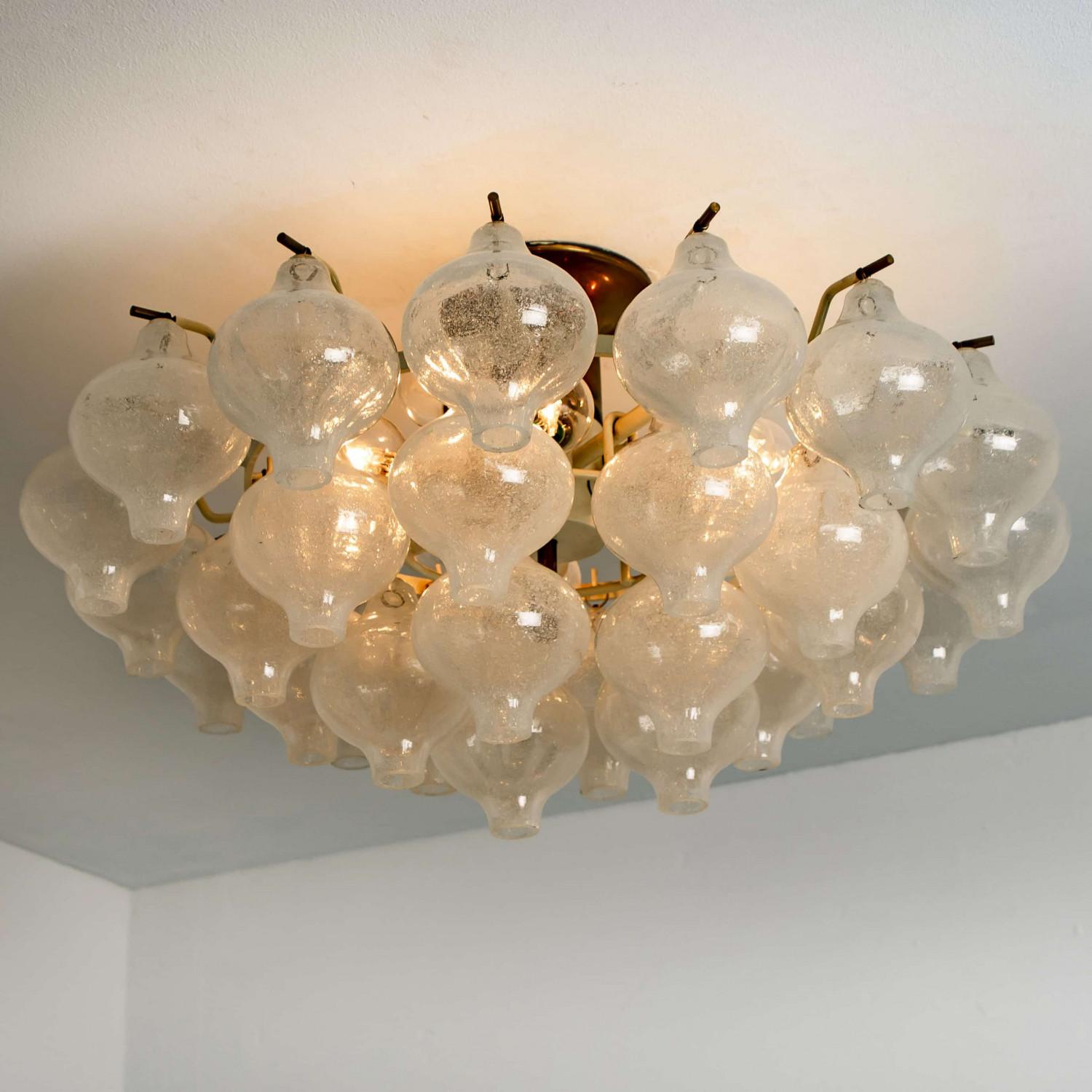 An exceptional 'Tulipan' flush mount chandelier by J.T. Kalmar, Austria, Vienna, manufactured in the Mid Century, circa 1970 (late 1960s-early 1970s). With beautiful Murano Tulipan shaped hand blown bubble glasses. Several glasses are mounted with