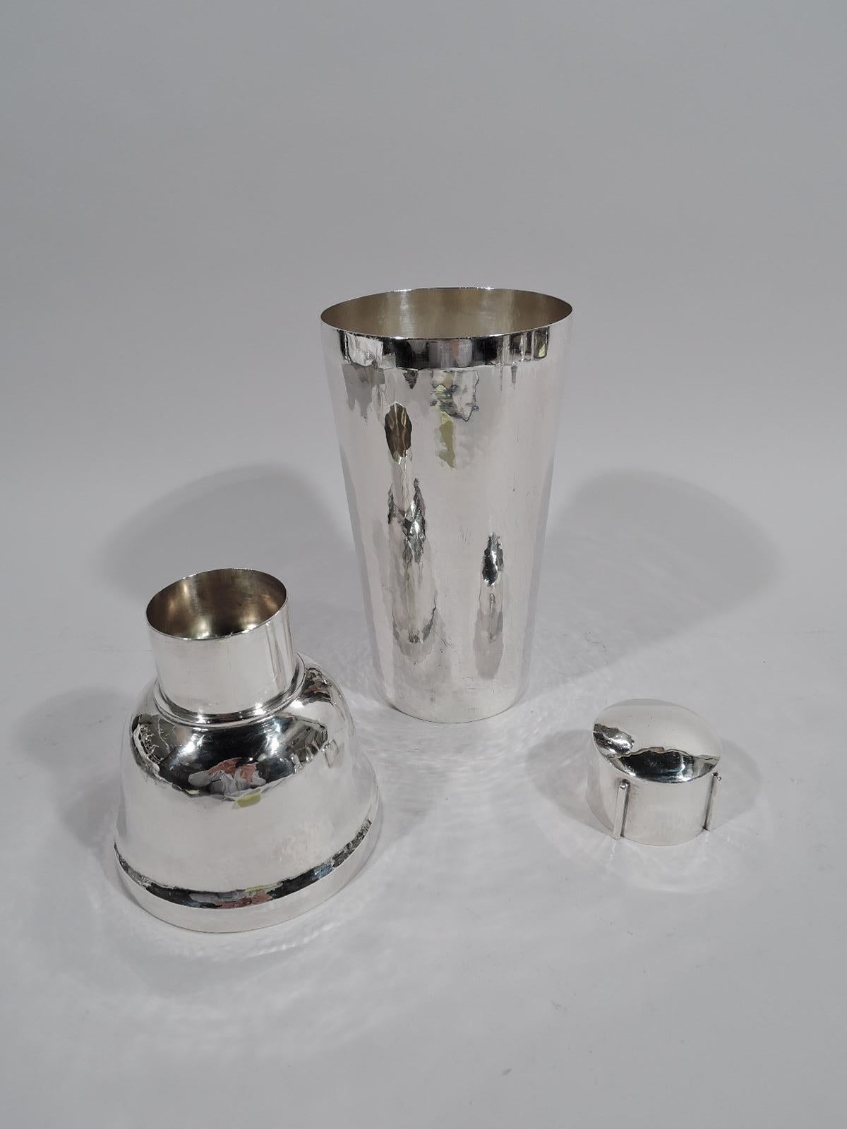 American sterling silver cocktail shaker. Made by The Kalo Shop in Chicago, circa 1920. Tapering cup, domed cover, and straight inset neck with built-in strainer. Cap has 4 applied lines for easy grip. Allover hand-hammering. A fine application of