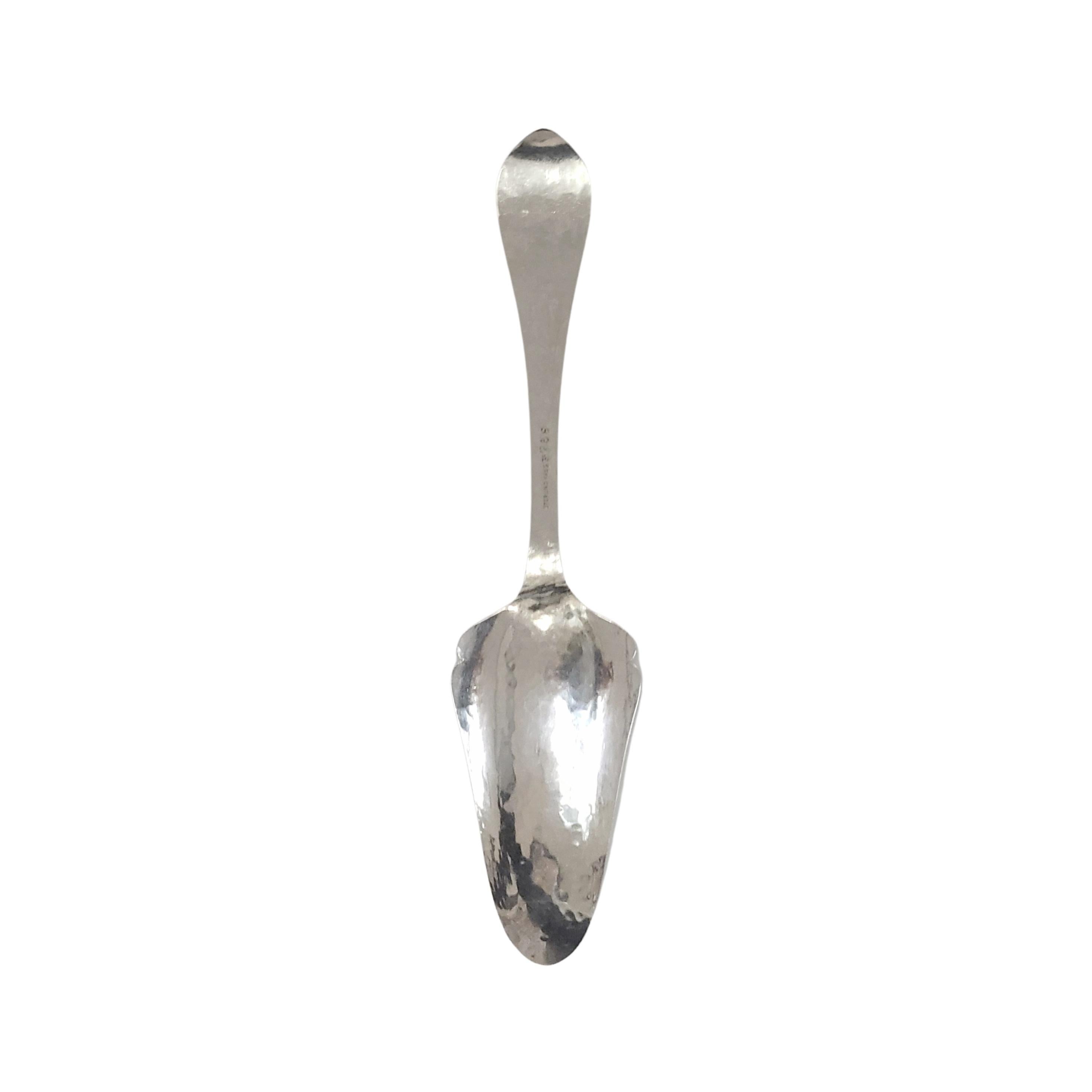 Hammered sterling silver jelly/pie server by The Kalo Shop.

No monogram

The Kalo Shop began producing handwrought objects in Chicago in 1900. Hallmark dates this piece to the early 1900s. It features a slightly hammered finish.

Measures approx 8