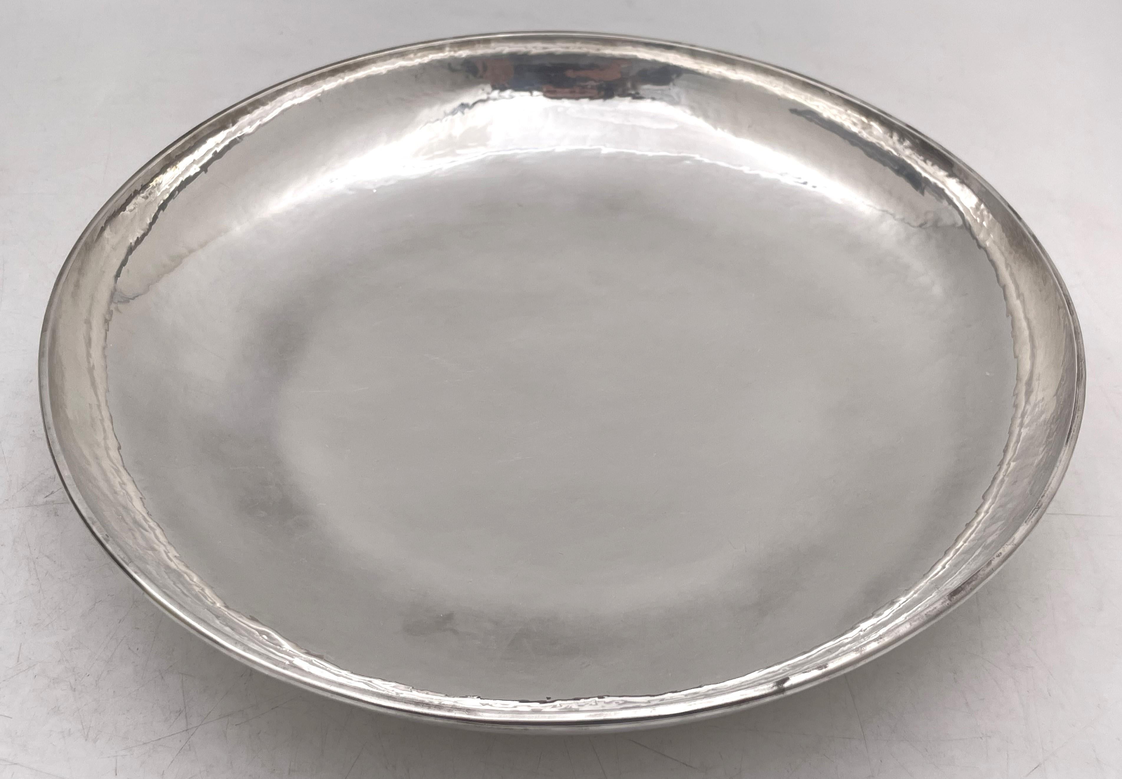 Kalo sterling silver hand wrought or hammered bowl, in Arts & Crafts style, made between 1912 and 1916. It measures 10'' in diameter by 2 1/4'' in height, weighs 19.1 troy ounces, and bears hallmarks as shown. 

The Kalo Shop was the 