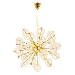 Kamenicky Senov, published by. Brass and glass chandelier. Circa 1970.