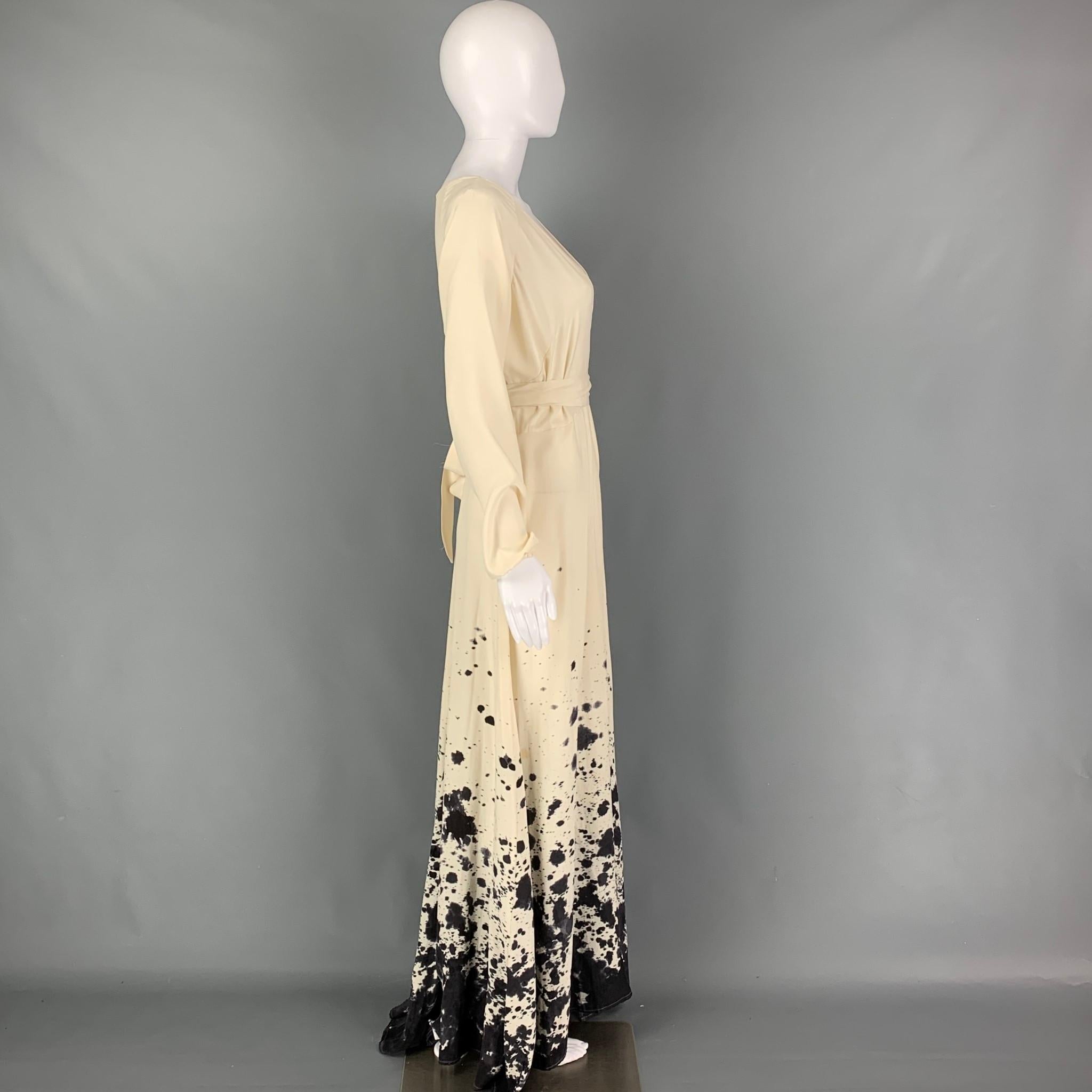 KAMPERETT dress comes in a cream & grey silk with hand painted details featuring a maxi wrap style, billowing full skirt, elastic cuffs, and a wrap around closure. Made in USA 

Good Pre-Owned Condition. Light discoloration.
Marked: S
Original