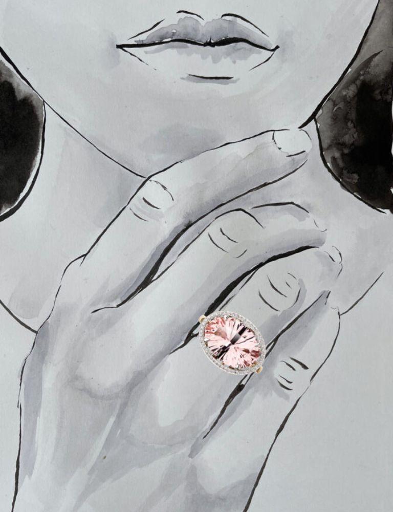 A Hero Ring within the Collection Light the Grey. Handcrafted in 18 Carat White and Yellow Gold, with a Large Central Morganite surrounded by Pave Set Brilliant Cut Diamonds.

The ring contains the Le Ster signature modern firework setting with