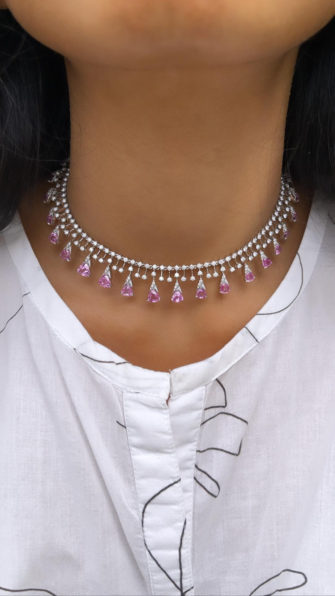 Trillion shape 0.50 carat pink sapphires, in combination with 0.05 carat round diamonds.  This choker is made in 18k white gold, and has a self adjustable ball chain mechanism.