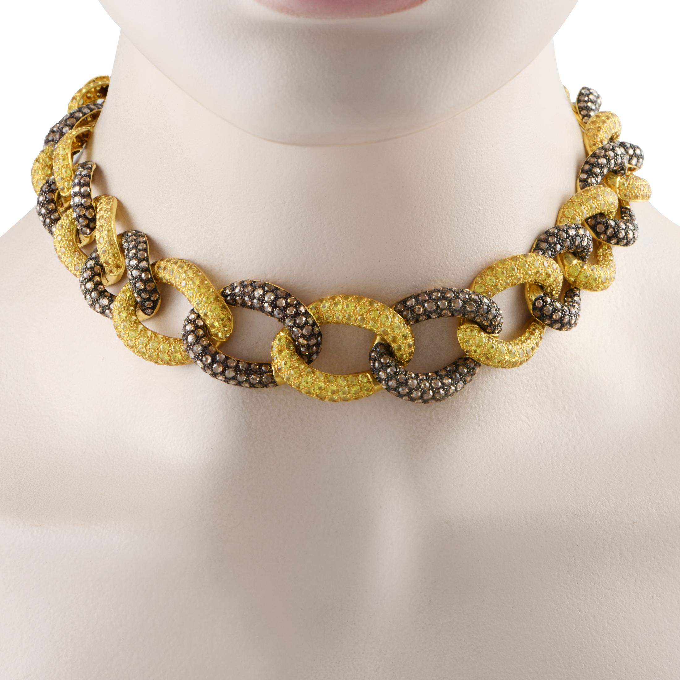 Make a bold style statement with this Kanaris choker necklace. It features a chain of oversized oval links, each slightly tilted and detailed with precious stones. The diamond-studded and yellow sapphire-embellished oval links alternately interlock,