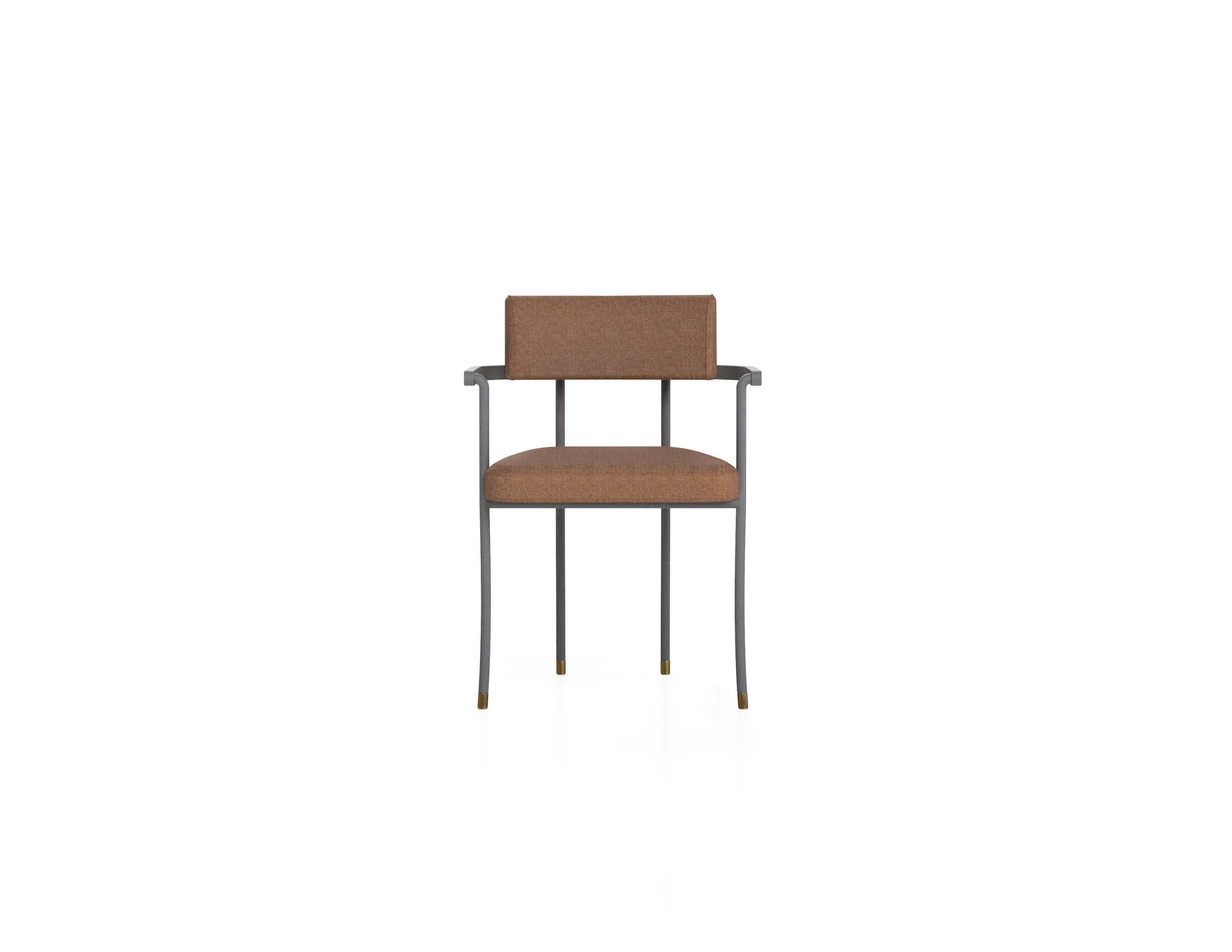 ‘The Kanat Dining Chair’ is simple yet elaborate chair that stands out with its elegant stance, fine details and comfort. Powder coated metal frame is elevated with brass plated antique finish details and upholstery. The masculine metal feeling is