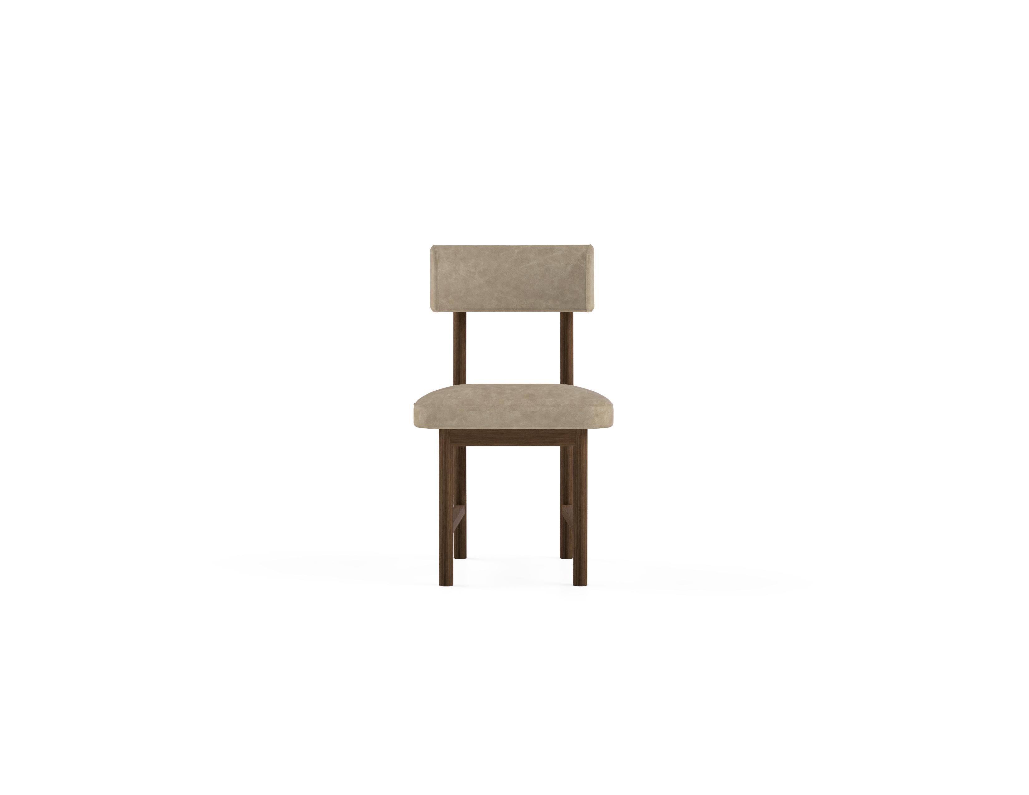 ‘The Kanat Dining Chair’ is simple yet elaborate chair that stands out with its elegant stance, fine details and comfort. Stained beech wood frame is elevated with antique plated metal finish details and upholstery. 

Material & Finish 
Seat and