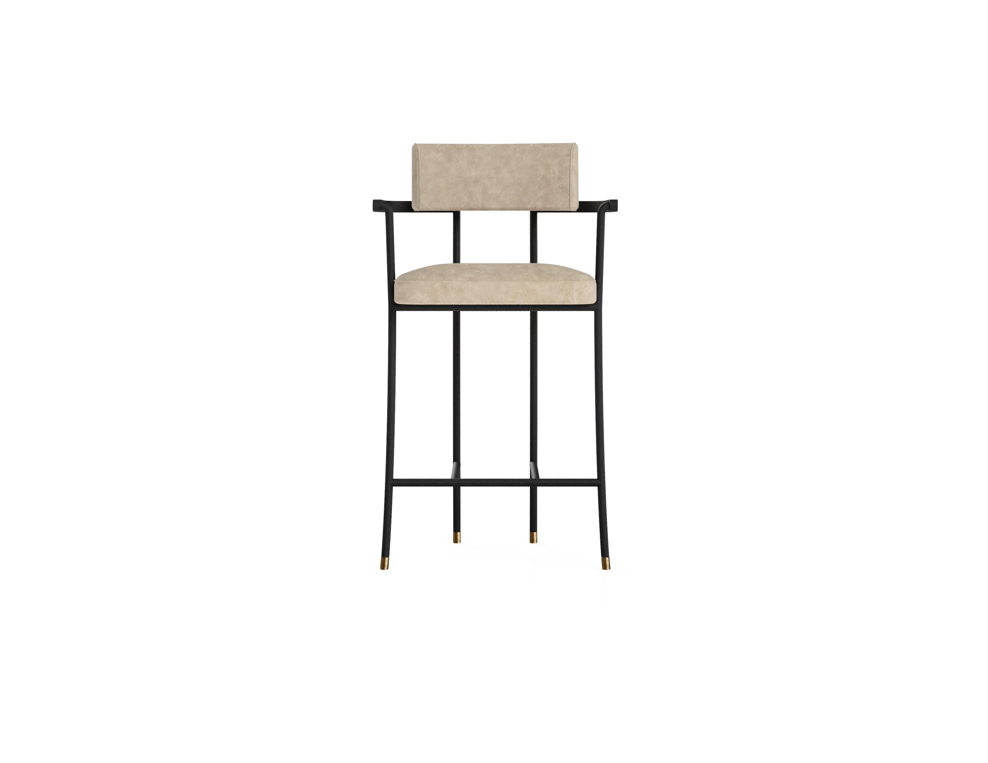 ‘The Kanat Bar Stool’ is simple yet elaborate piece that stands out with its elegant stance, fine details and comfort. Powder coated metal frame is elevated with antique  plated metal details and upholstery. The masculine metal feeling is balanced