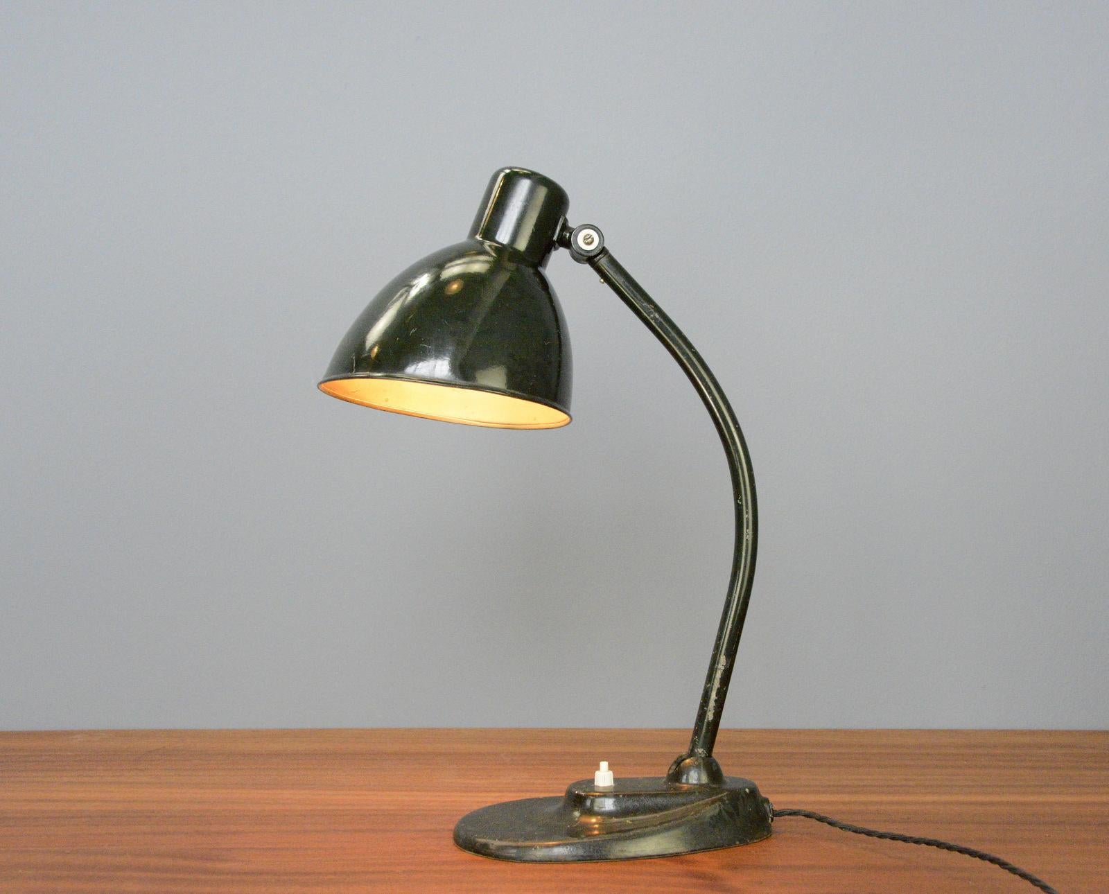 Kandem 756 desk lamp Circa 1930s.

- Cast iron stepped base
- Steel arm and shade
- Original On/Off toggle switch on the shade
- Produced by Korting and Mathiesen, Leipzig
- Designed By Hin Bredendieck, Hermann Gautel -Bauhaus.
- German ~