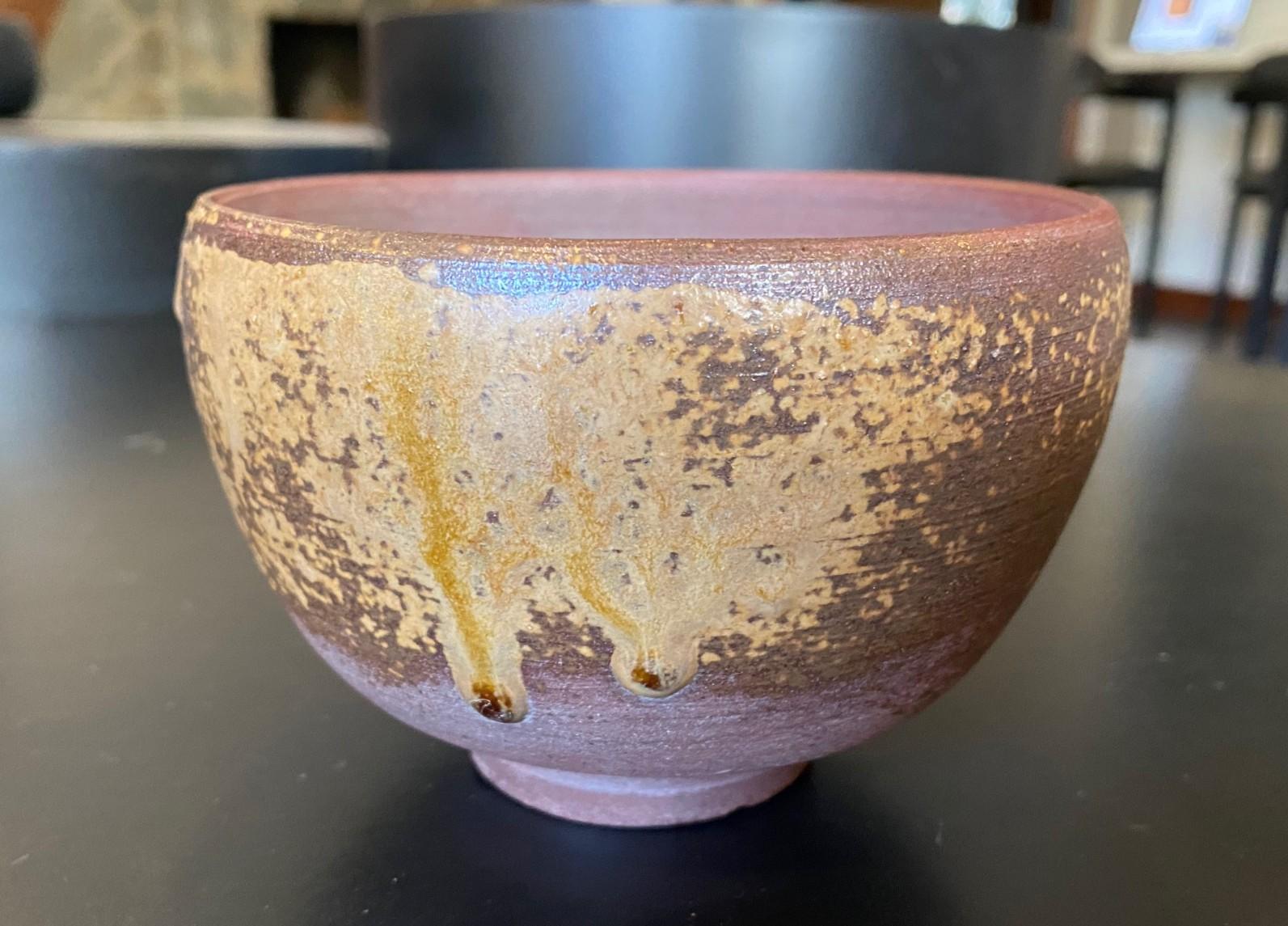A beautiful, perfectly shaped antique Bizen ware Chawan tea bowl by renowned Japanese master potter/artist Kaneshige Toyo (1896-1967) featuring a unique one of a kind, natural, organic forming ash glaze. Kaneshige is universally considered to be the