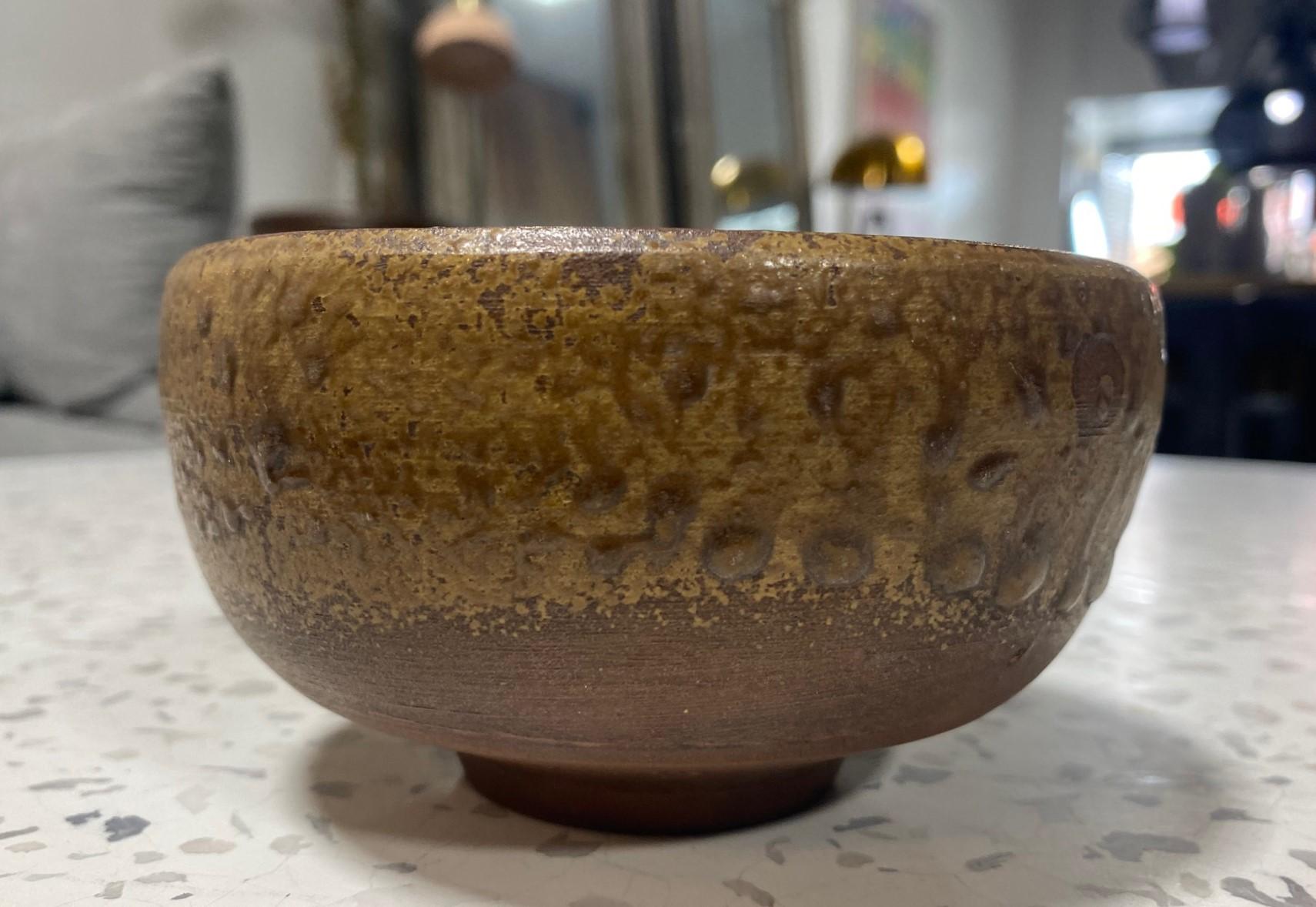 A beautiful, perfectly shaped antique Bizen ware Chawan tea bowl by renowned Japanese master potter/artist Kaneshige Toyo (1896-1967) featuring a unique natural, organic forming ash glaze. Kaneshige is universally considered to be the founder of