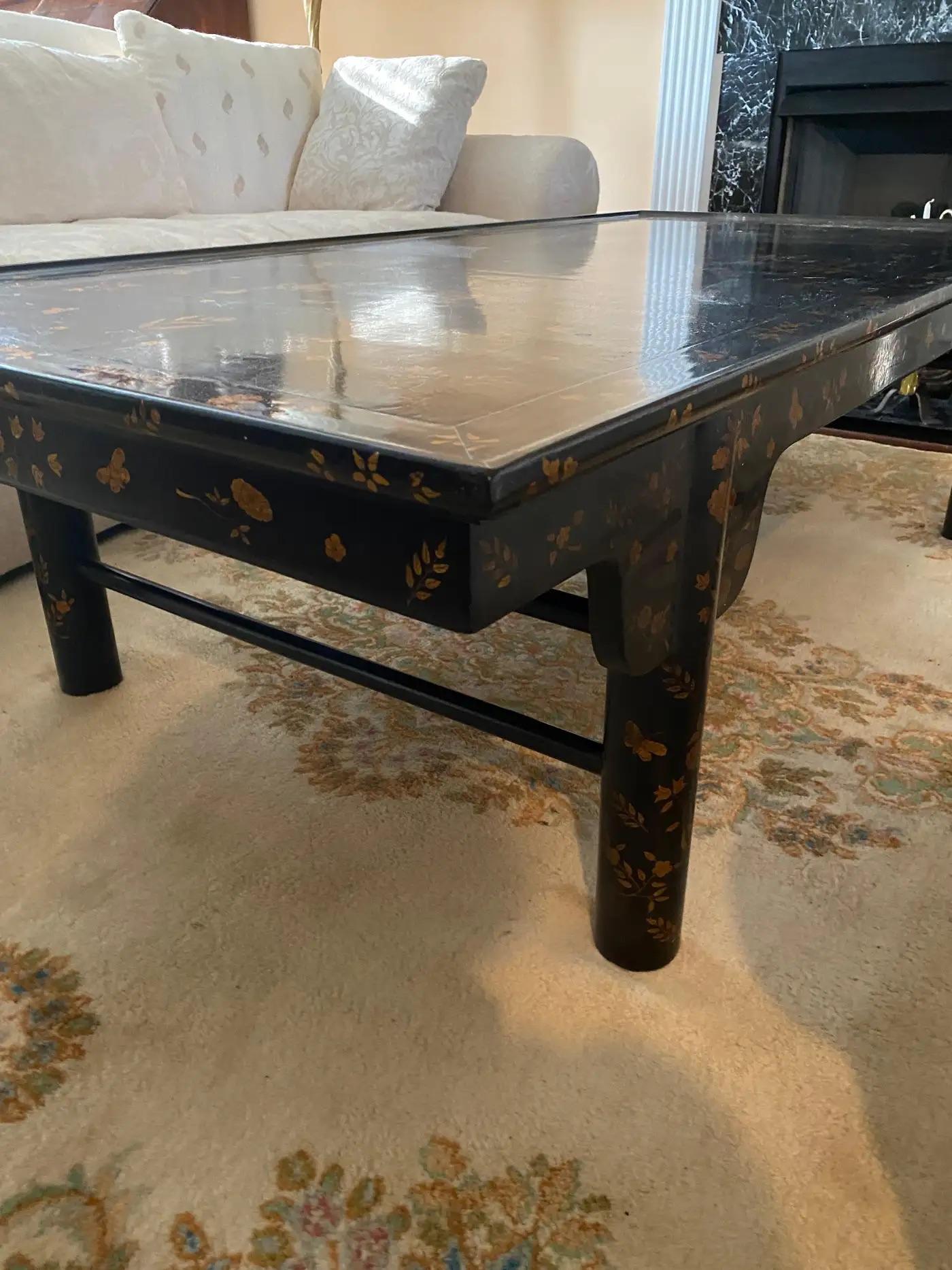 K'ang Hsi Coffee Table by Rose Tarlow 'Melrose House,' Chinese style with intricate black lacquer and hand-painted gold leaf flowers. 

Featuring a unique design with turned-up sides on the top and support stretchers on each side.

Measuring 34