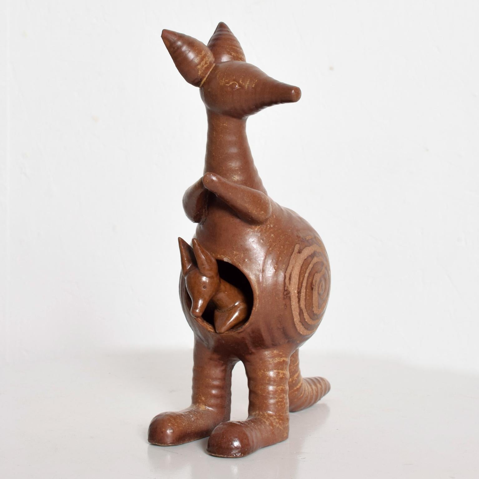 We are pleased to offer you a Kangaroo and Joey ceramic pottery by Lisa Larson for Gustavberg, Sweden. Stamped underneath with makers label. Dimensions: 9 1/2