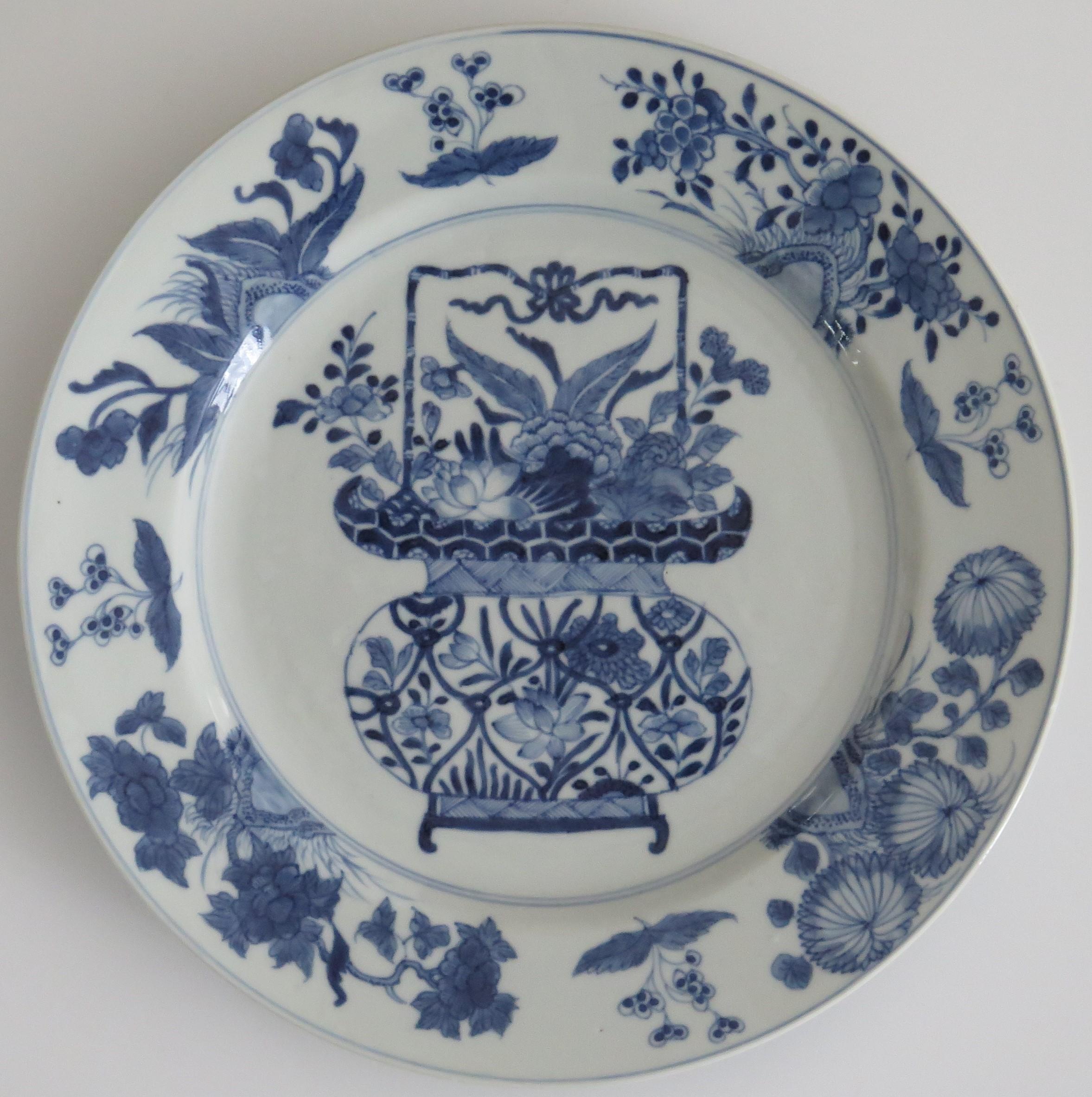 This is a beautifully hand-painted Chinese porcelain blue and white large plate or Platter, from the Qing, Kangxi period, 1662-1722.

The plate is finely potted with a carefully cut base rim and a lovely rich glassy, very light blue glaze and very
