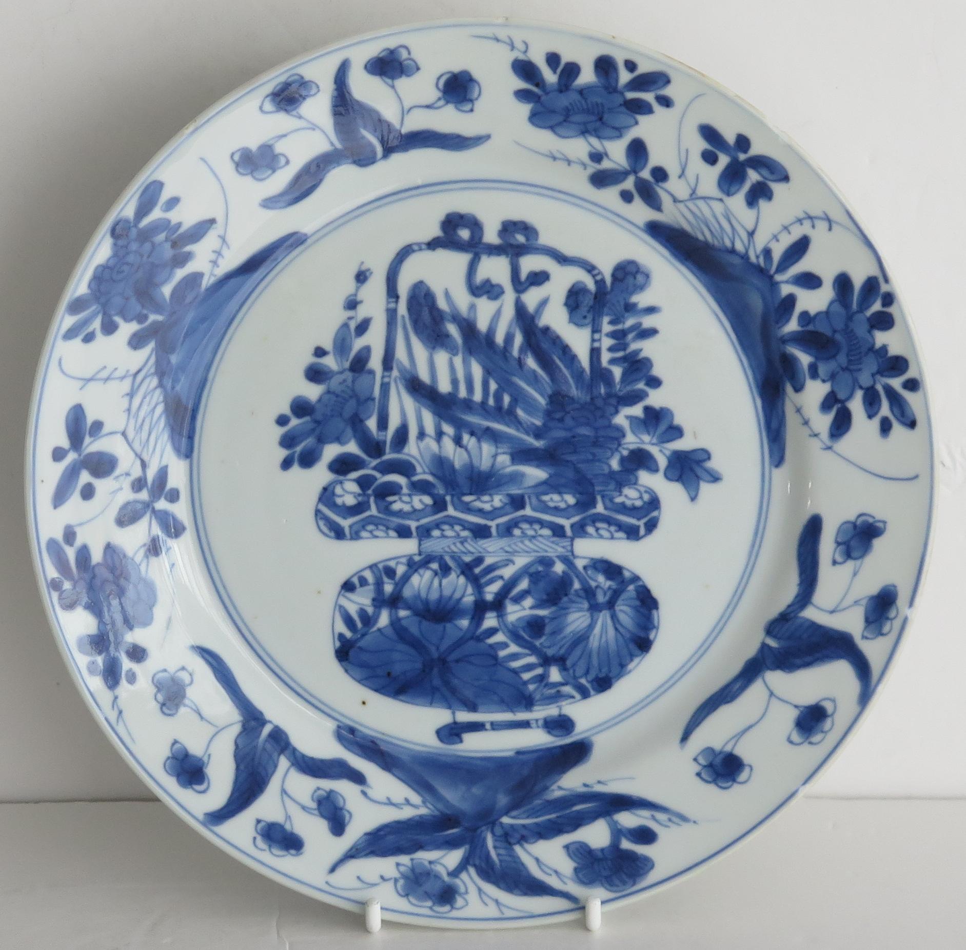 This is a beautifully hand-painted Chinese porcelain blue and white plate from the Qing, Kangxi period, 1662-1722.

The plate is finely potted with a carefully cut base rim and a lovely rich glassy, very light blue glaze.

The plate is