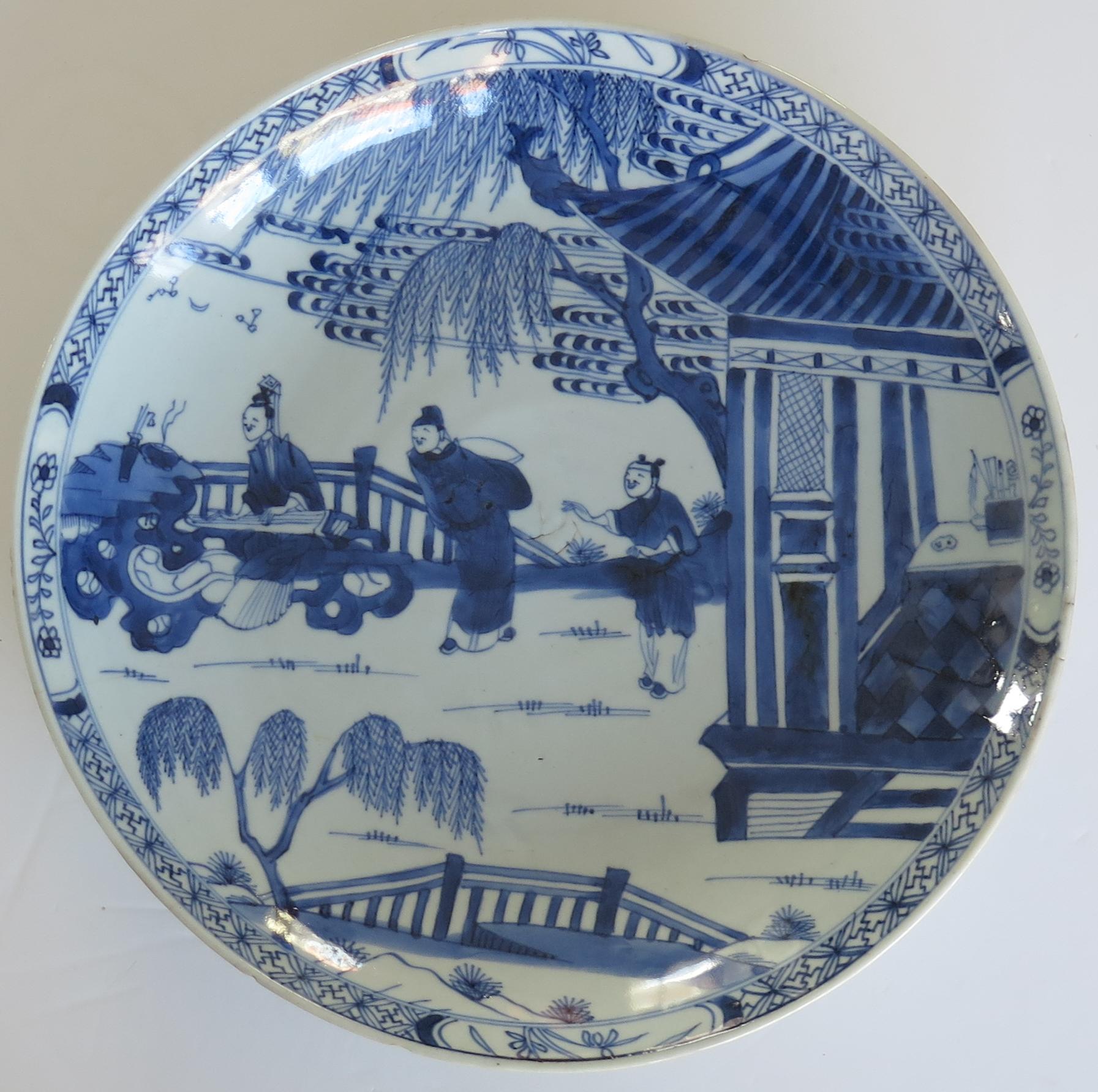 This is a very beautifully hand painted Chinese porcelain blue and white large Dish or Plate from the Qing, Kangxi period, 1662-1722, dating to Circa 1690.

This is a large fairly deep plate measuring 11.15 inches ( about 282 mm) diameter, which