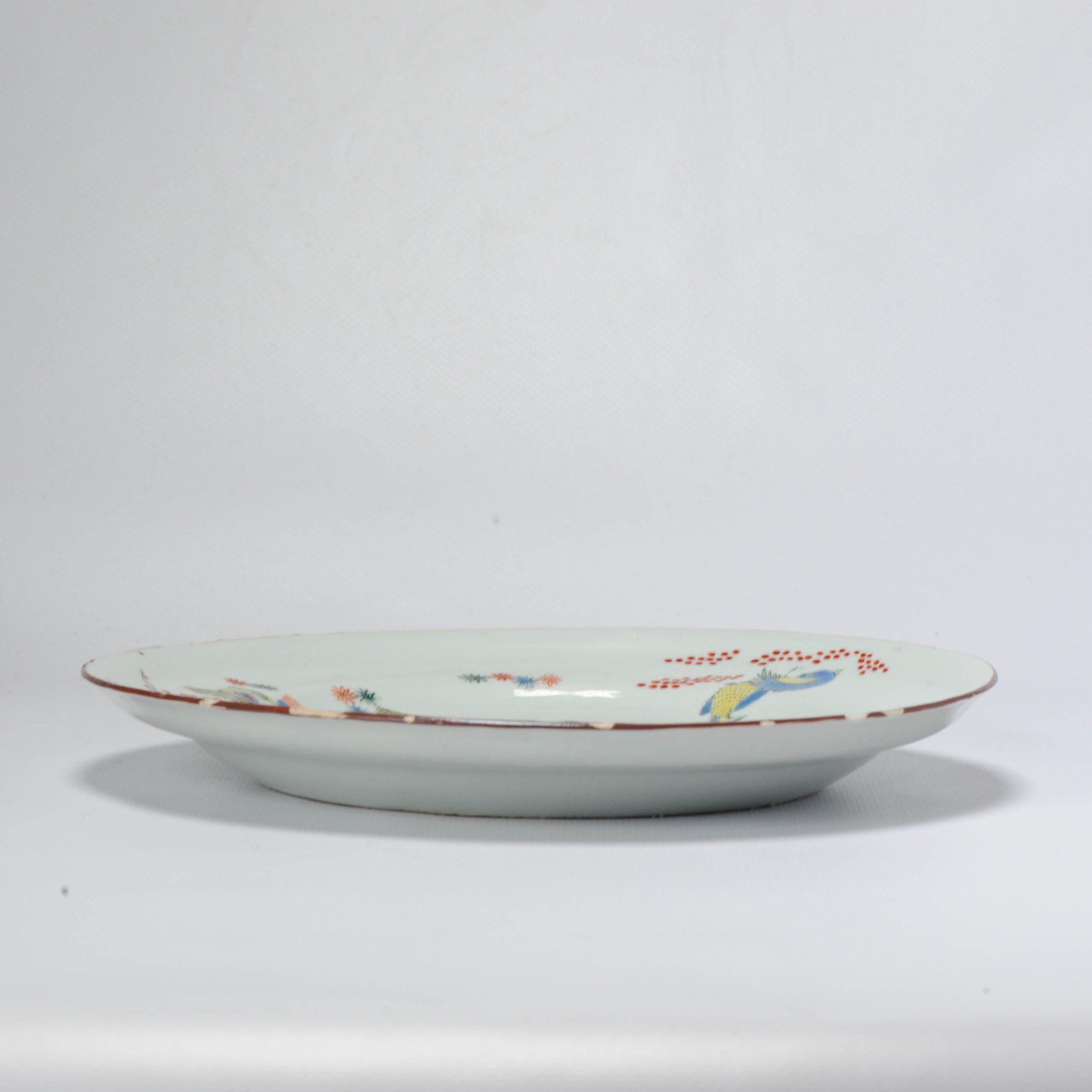 A Japanese Kakiemon-style bird, quail and Three friends of winter dish. Painted by by a Dutch painter to decorate a Chinese porcelain blank.

The scene and quality of paintting is amazing.

Three Friends of Winter
These are pine, Prunus mume and