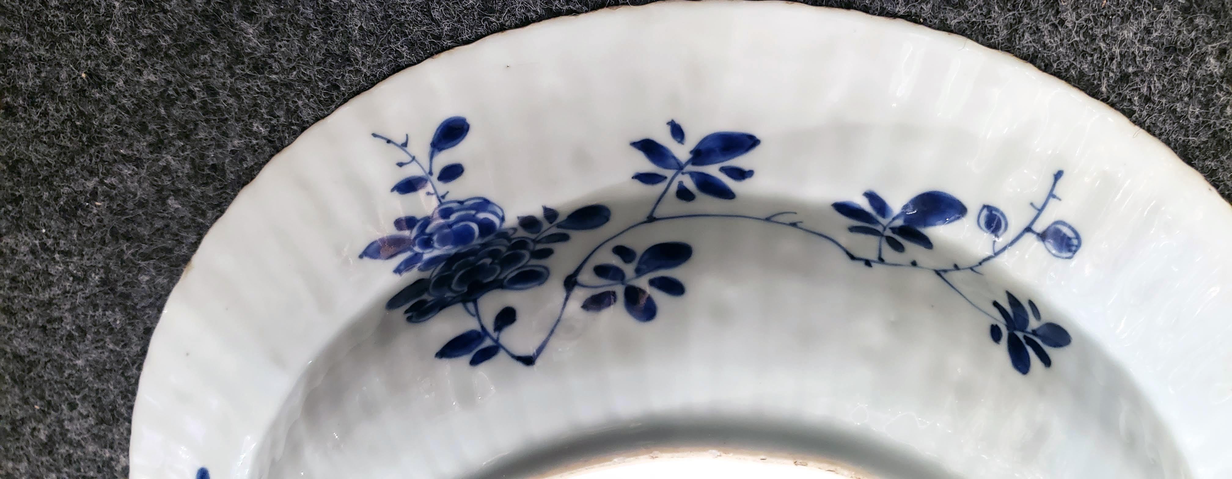 Kangxi period Chinese underglaze blue moulded basin,
circa 1700-1710.
(VM98339).

The deep Chinese underglaze blue porcelain basin from the Kangxi period has a moulded fluted ribbed body with the wide rim with twelve painted lotus leaf-shaped