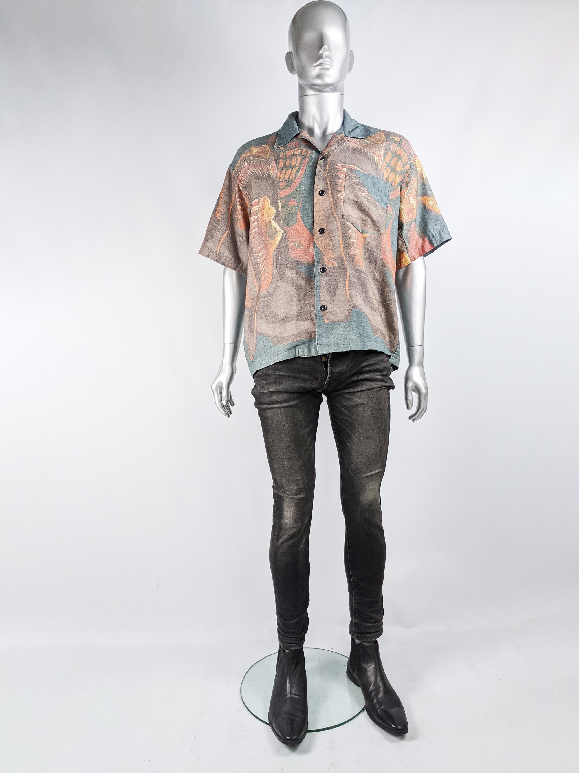 A stylish and rare vintage oversized mens short sleeve shirt from the 80s by legendary Japanese fashion designer, Kansai Yamamoto, who was known for his bold look worn by the likes of David Bowie. In a grey fabric with an orange cowboy boot pattern