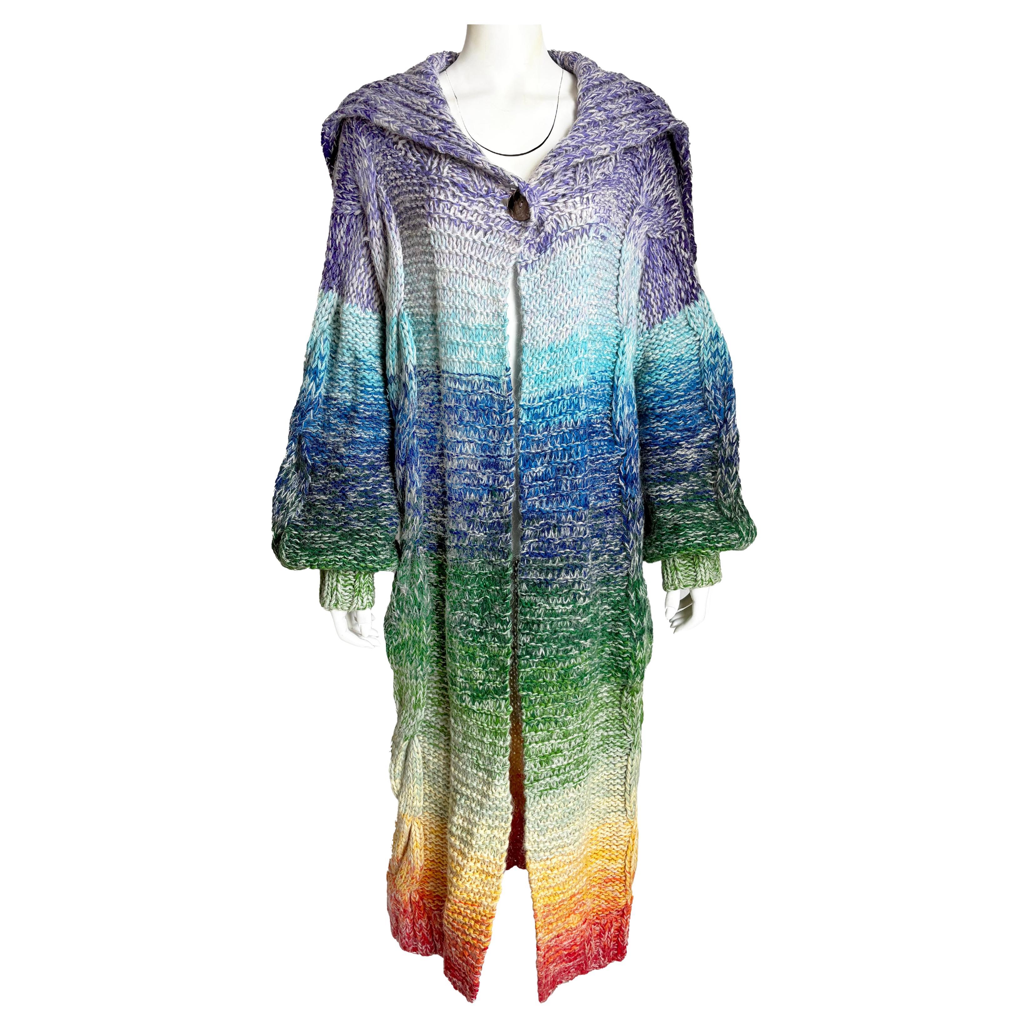 A bold statement piece from the visionary designer Kansai Yamamoto, this vintage oversized knit sweater or duster captures the exuberance and theatricality of 1970s Japanese avant-garde fashion.

Crafted in a wool, mohair, and nylon chunky knit, the