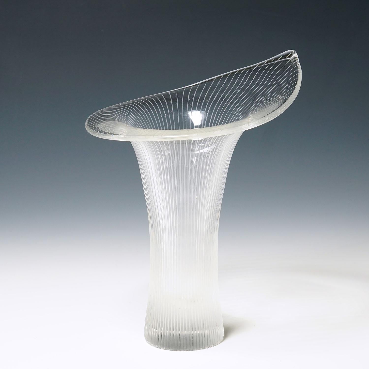 Kantarelli Art glass vase by Tapio Wirkkala for Iittala, 1951

A large vintage 'Kantarelli' (chantertelle) vase designed by Tapio Wirkkala for Iittala Glassworks in 1951. Mold blown crystal clear glass with line cuttings. Marked with incised