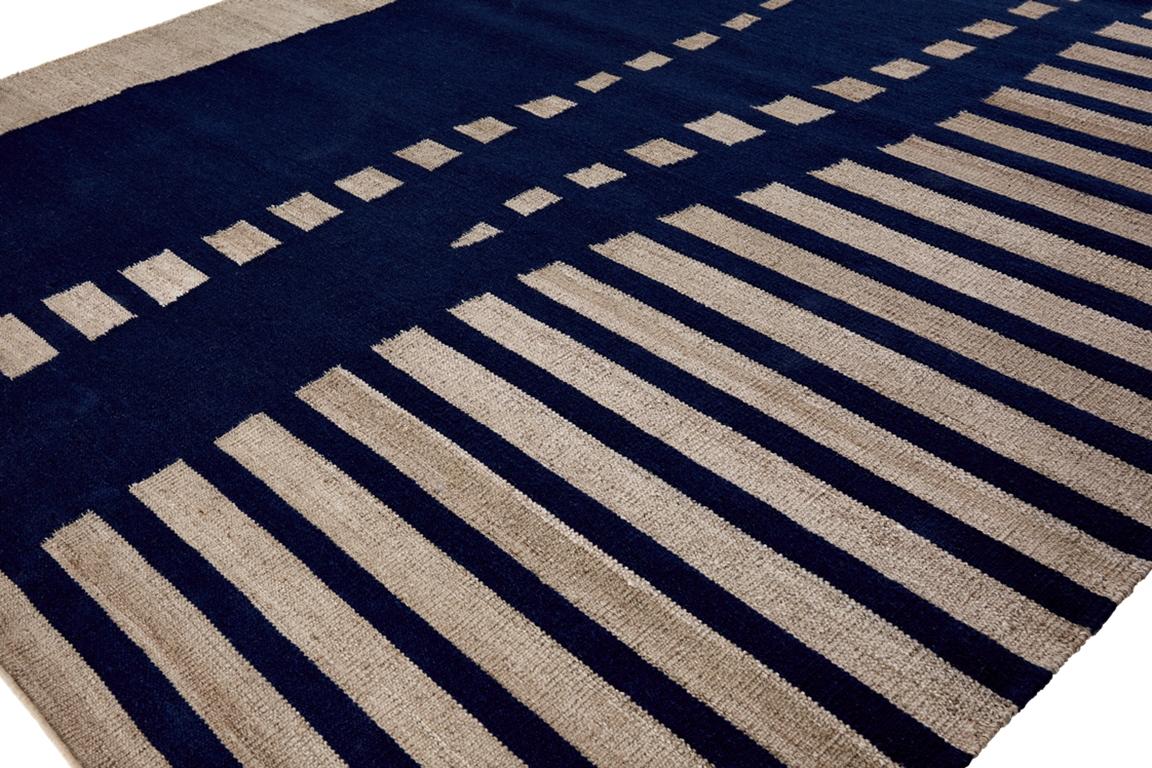 The 'Kanya' Rug is meticulously hand-woven using sustainable wool and allo fibers. Its design and durable construction ensure both aesthetic appeal and longevity. Crafted with care and attention to detail, this rug embodies timeless beauty and