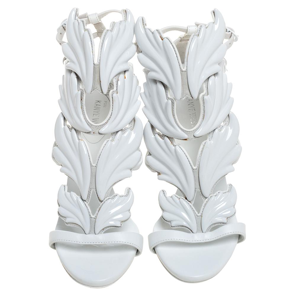 Breathtakingly beautiful, these pristine white Kanye West x Giuseppe Zanotti sandals are sure to take your breath away! The Cruel sandals have been crafted from leather into an open-toe silhouette and designed with wings. They are equipped with