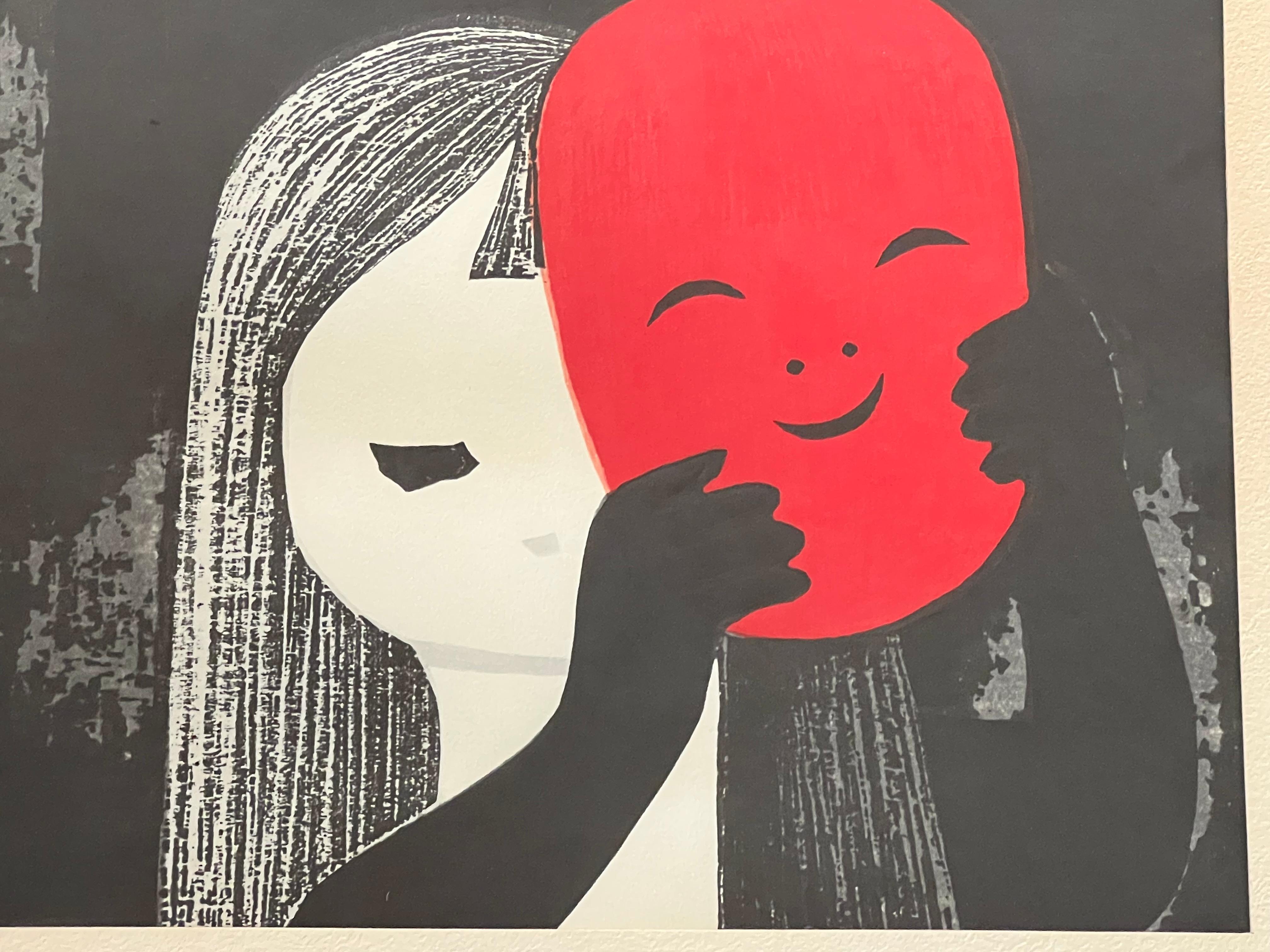 This whimsical woodblock print depicts a young girl holding a red mask up her face. 
Kaoru Kawano was a woodblock print artist who worked during the Showa period (1926-1989). Born in Hokkaido in 1916, Kawano studied at Kawabata Art School during the