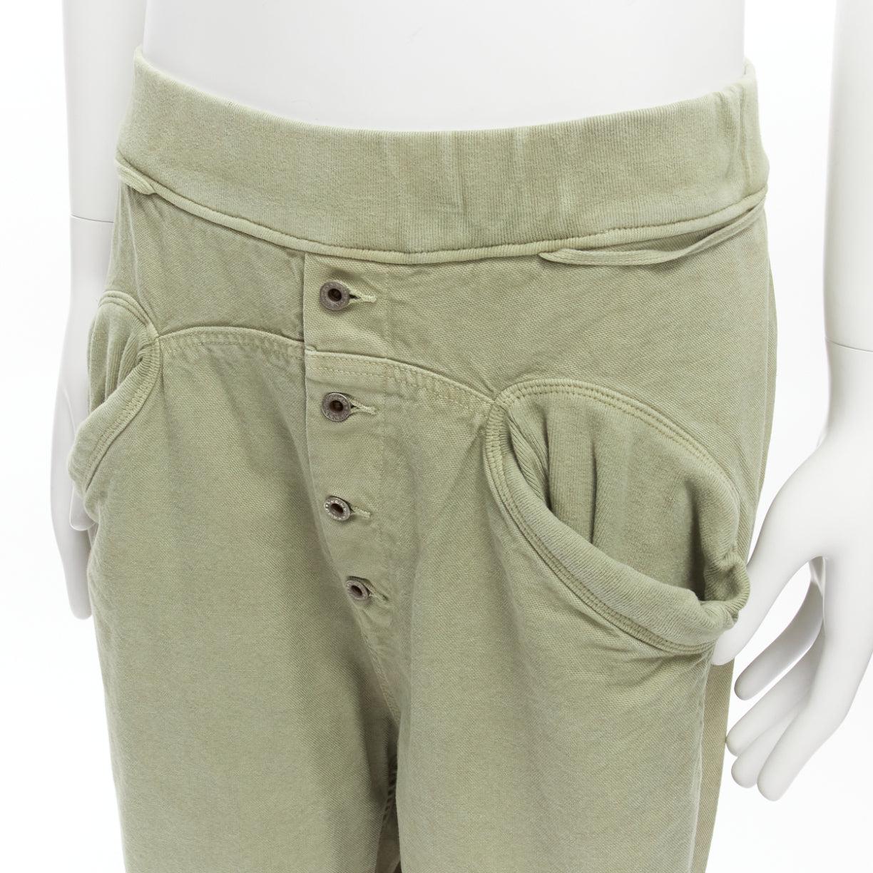 KAPITAL 100% washed cotton green distressed buttons elasticated waist pant JP3 L
Reference: YNWG/A00173
Brand: Kapital
Material: Cotton
Color: Green
Pattern: Solid
Closure: Button Fly
Extra Details: Button fly and elasticated waistband closure. 2