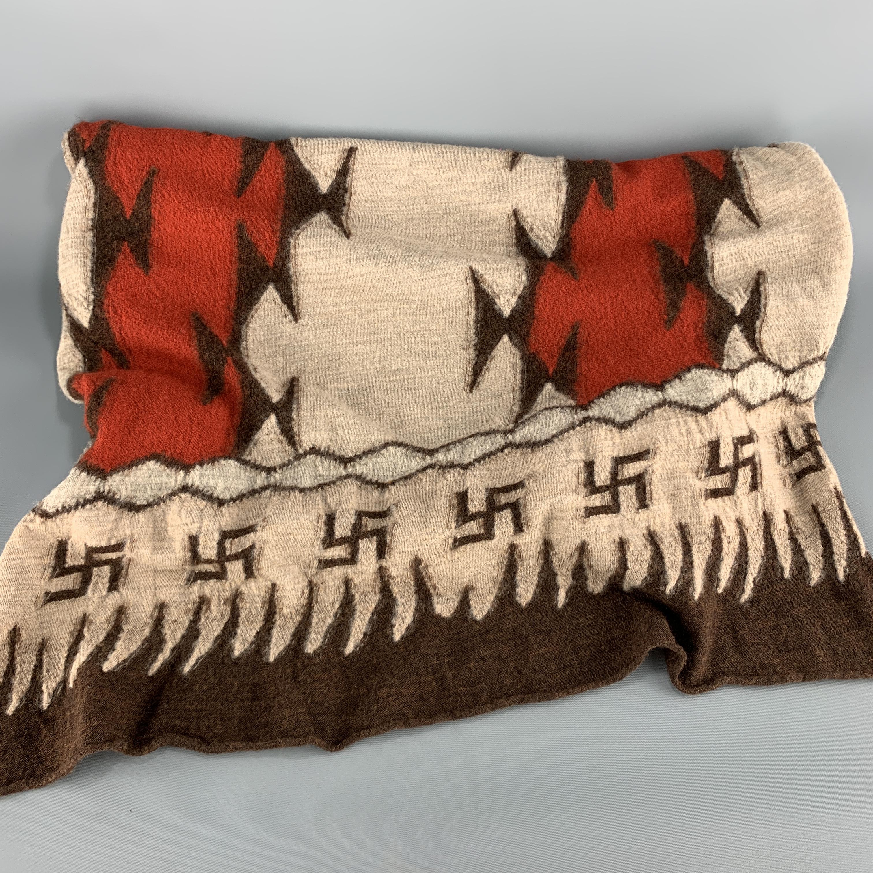 KAPITAL scarf comes in beige wool jersey knit with a brown and orange pattern throughout and Buddhist peace sign print trim. Made in Japan.

New with Tags. 

96 x 27 in.
