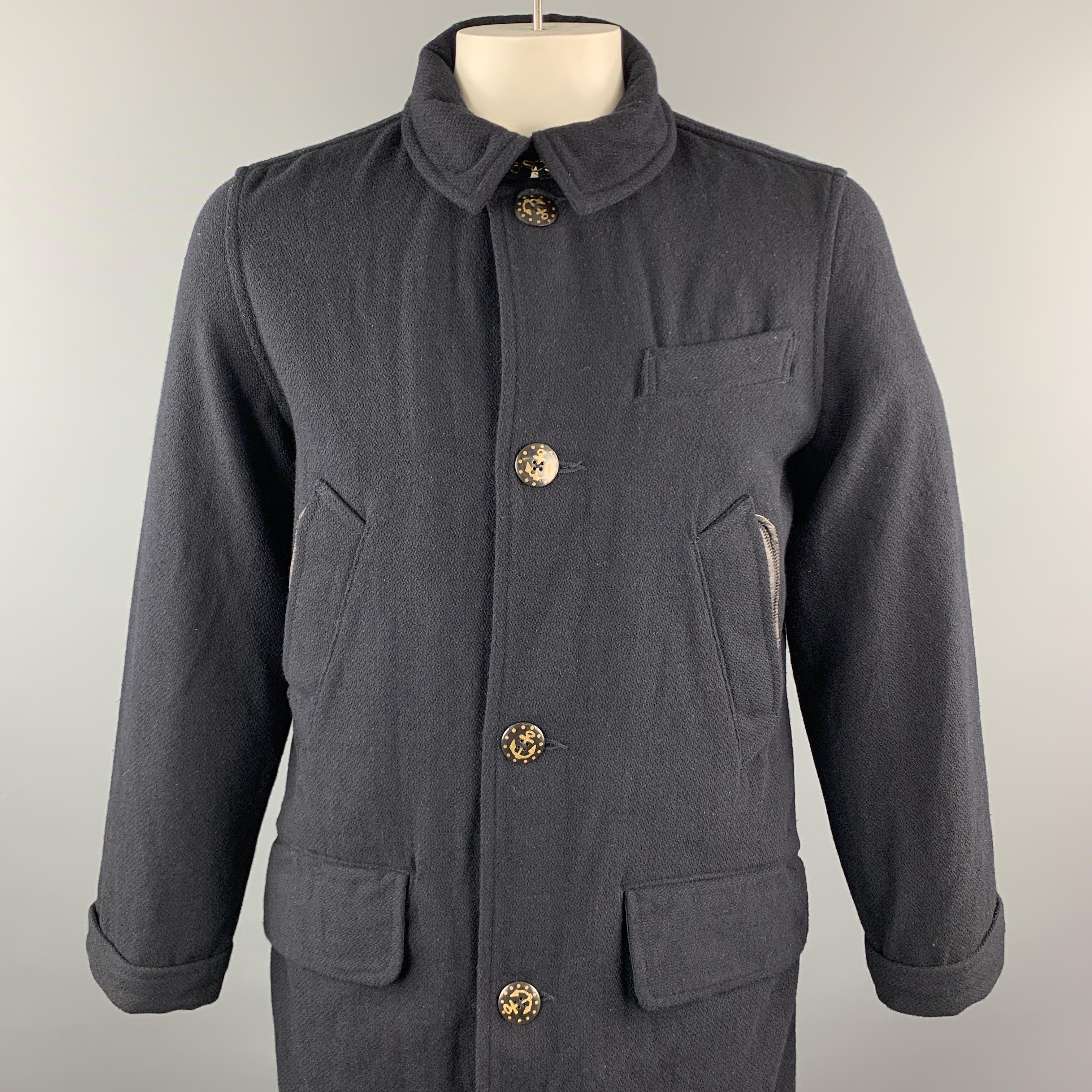 KAPITAL Coat comes in a navy wool / nylon featuring a leather trim detail, flap pockets, and a button closure. Made in Japan.

New With Tags.
Marked: 4
Original Retail Price: $986.00

Measurements:

Shoulder: 18 in.
Chest: 46 in.
Sleeve: 26.5 in.