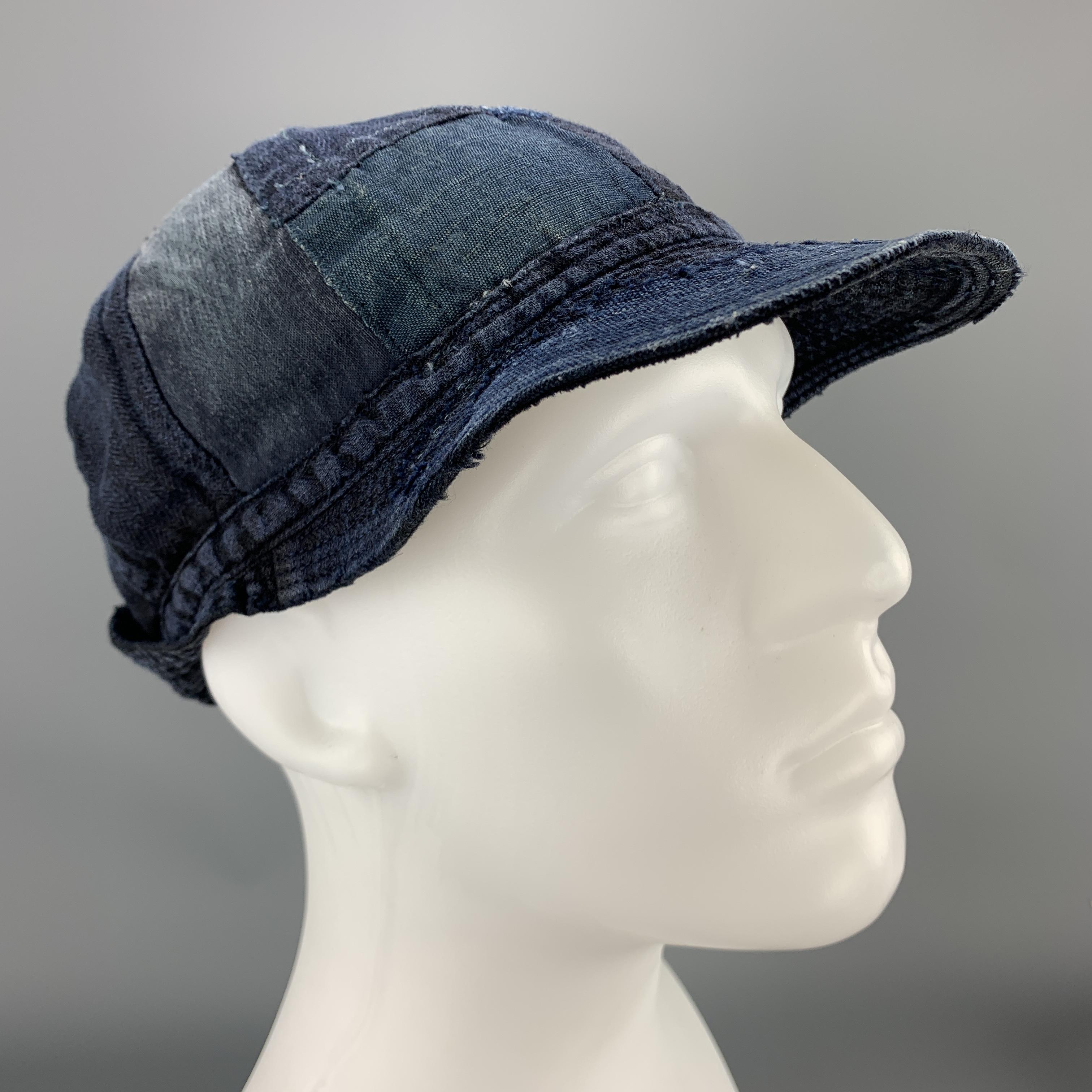 KAPITAL hat comes in light weight indago denim blue linen with patchwork throughout, quilted brim, and buttoned back detail. Made in Japan.

New with Tags.

Measurements:

Opening: 24 in.
Brim: 3 in.
Height: 5 in.