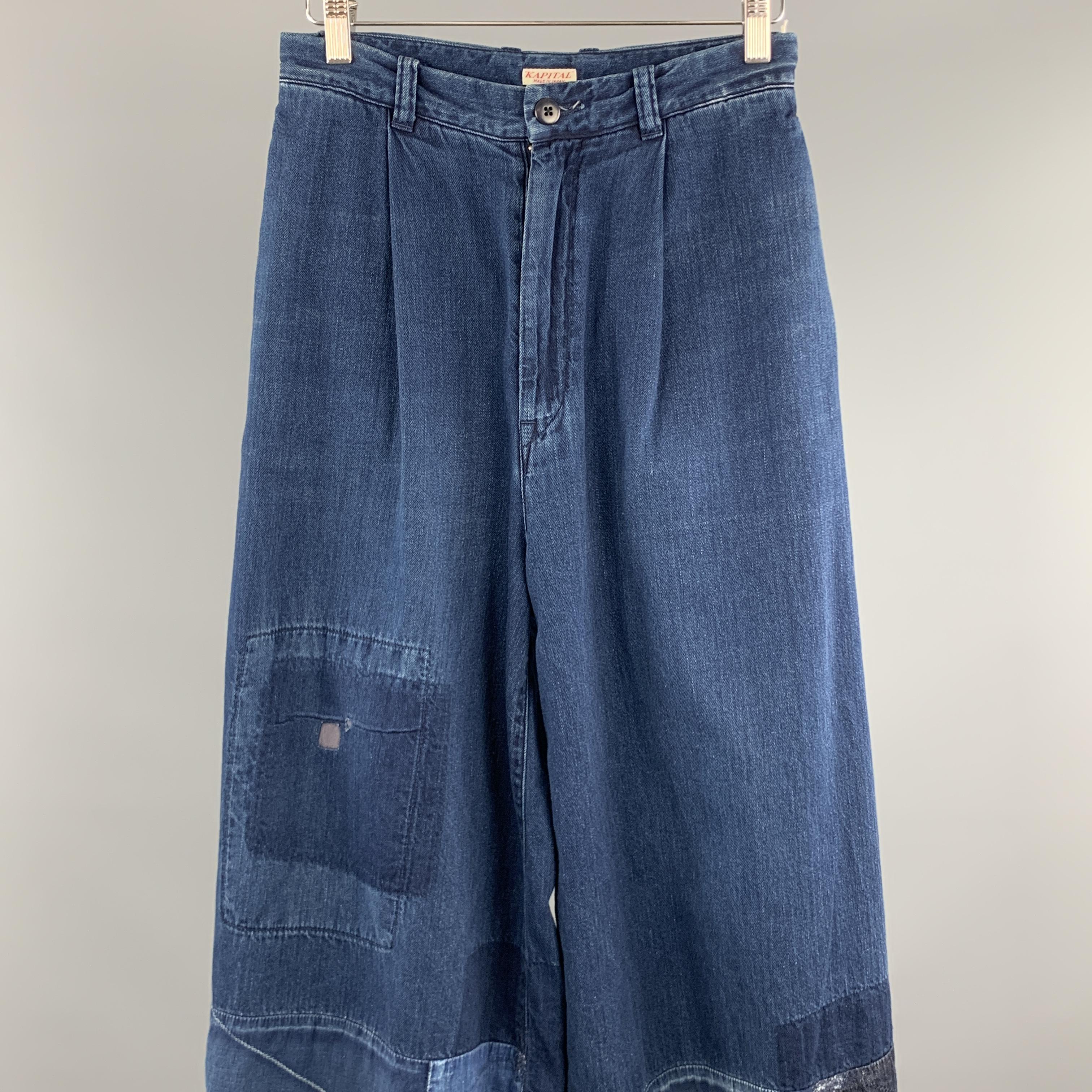 KAPITAL Casual Pants comes in a indigo cotton featuring a wide leg style, patchwork details, and a zip fly closure. Made in Japan. 

New With Tags.
Marked: 0

Measurements:

Waist: 26 in. 
Rise: 13.5 in. 
Inseam: 22.5 in. 