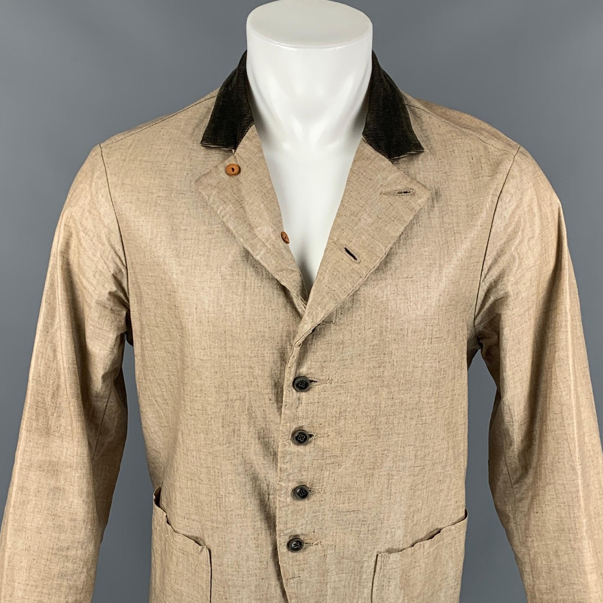KAPITAL coat comes in a beige coated canvas featuring a corduroy collar, patch pockets, and a buttoned closure. Made in Japan. 

Very Good Pre-Owned Condition.
Marked: 3

Measurements:

Shoulder: 17.5 in.
Chest: 40 in.
Sleeve: 26 in.
Length: 26 in. 