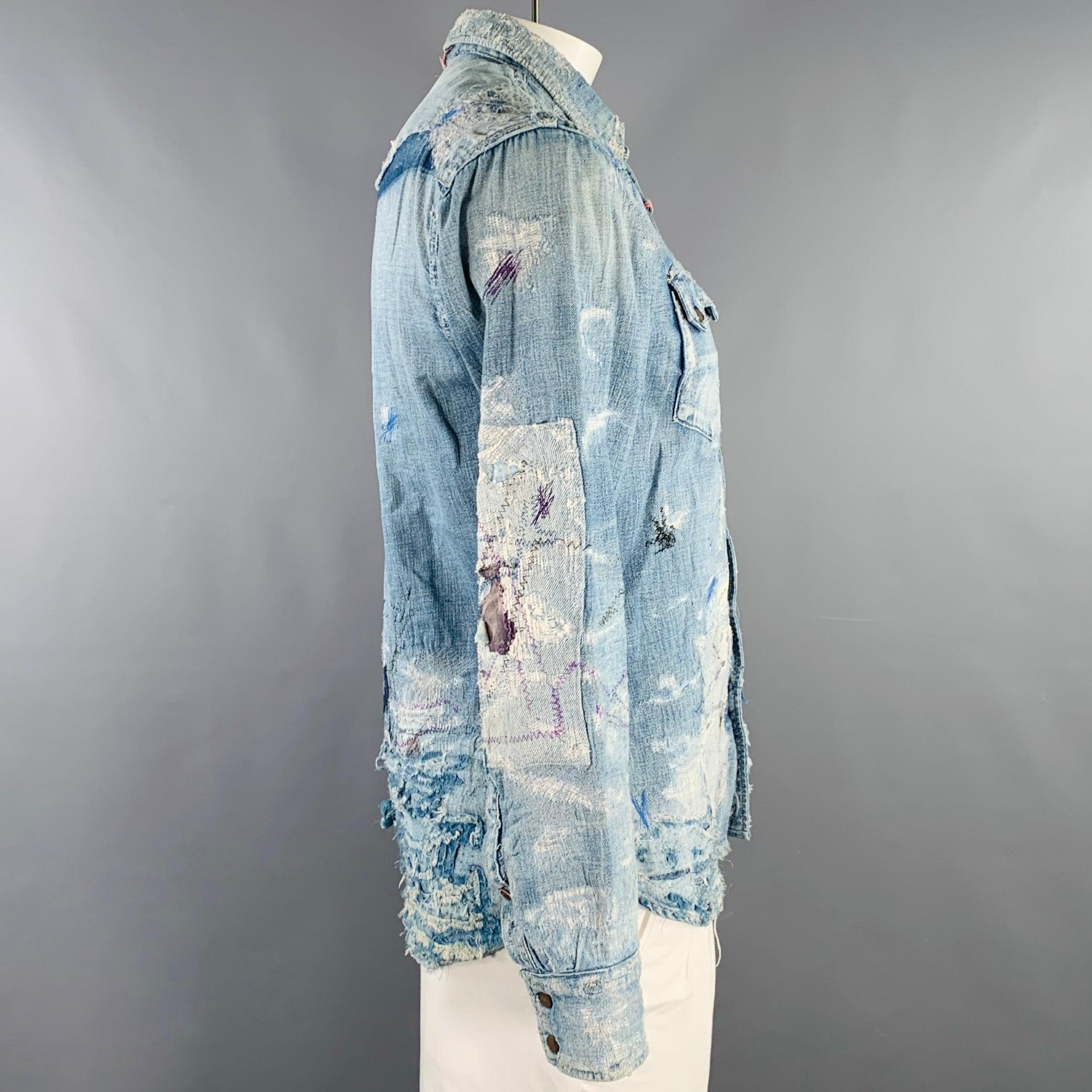 KAPITAL KOUNTRY long sleeve shirt
in an indigo denim featuring a distressed design, Western style with two snap chest pockets, and snap closure. Made in Japan. Note: the sleeves on this garment have been professionally altered and are slightly