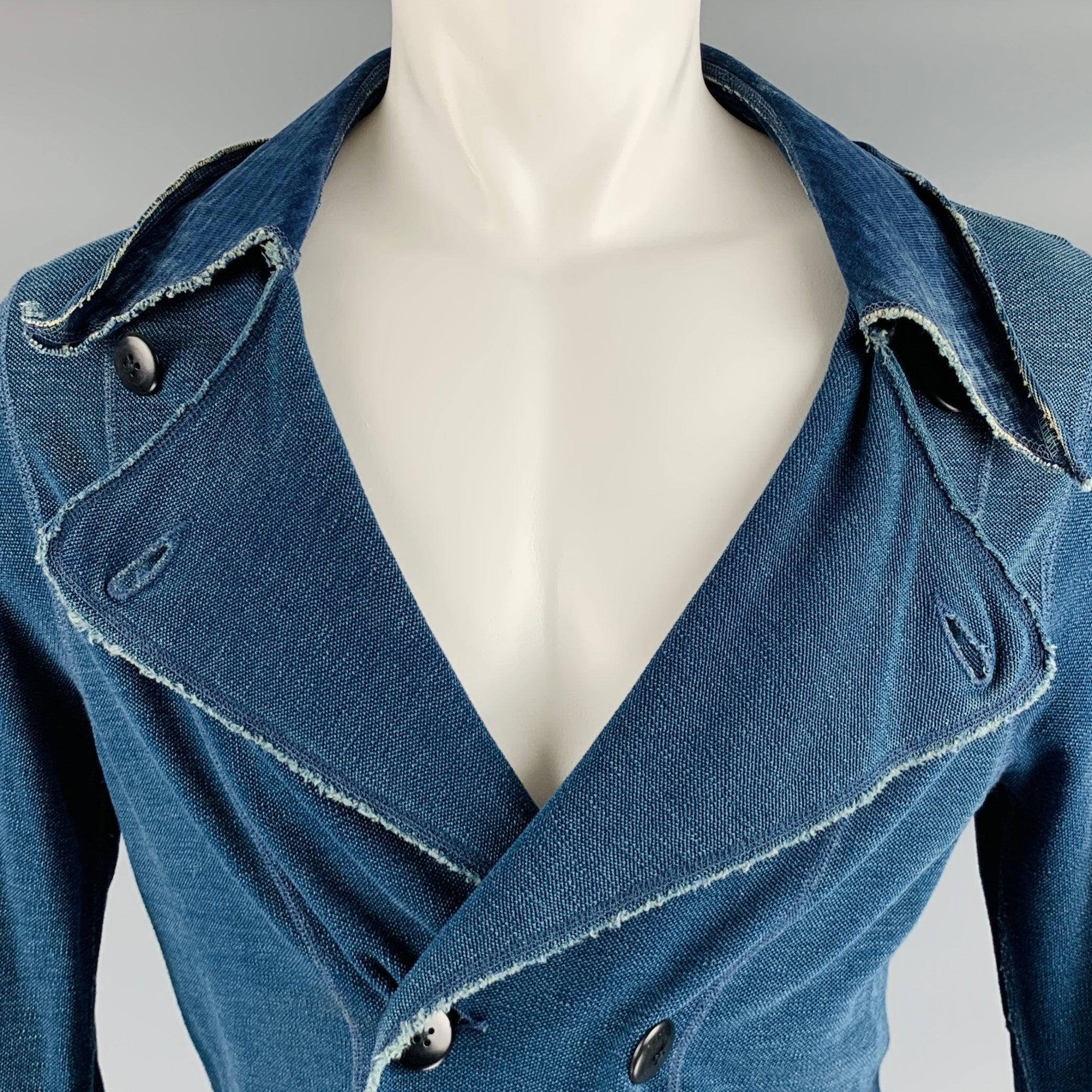 KAPITAL jacket
in a navy linen blend woven fabric featuring an unlined double breasted style, dramatic spread collar, two pockets, and button closure.Very Good Pre-Owned Condition. Moderate mark on front. As is. 

Marked:   size not marked, care tag