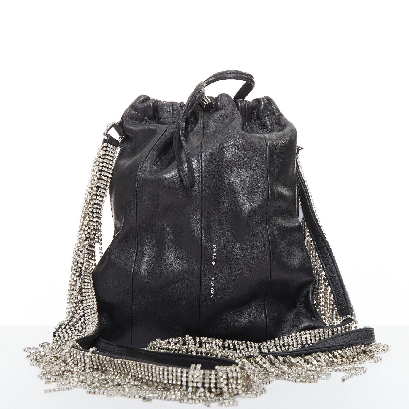 KARA black leather white logo strass fringe crystal mini backpack bag
Reference: ECLO/A00171
Brand: Kara
Material: Leather
Color: Black, Clear
Pattern: Solid
Closure: Drawstring
Lining: Black Leather
Extra Details: KARA blends classic glamour with