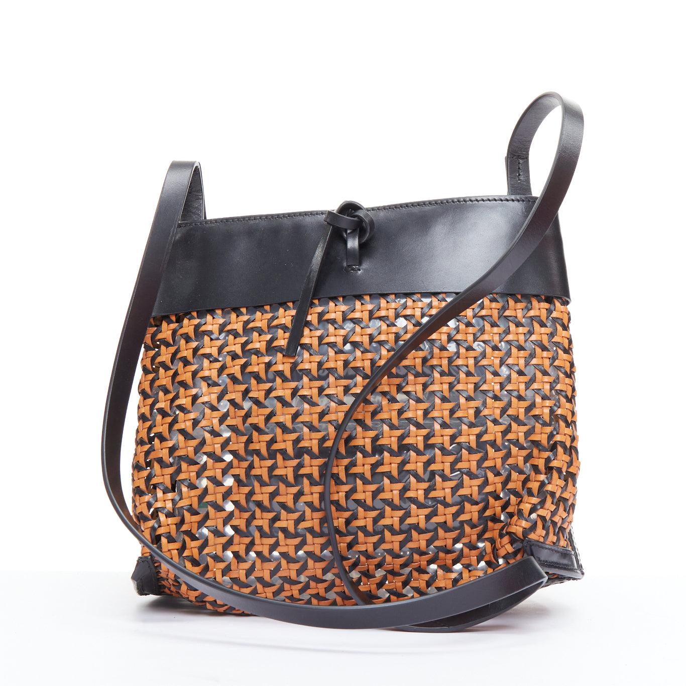 KARA brown woven leather black trimmed tie front crossbody bag
Reference: ECLO/A00066
Brand: Kara
Material: Leather
Color: Black, Brown
Pattern: Solid
Closure: Self Tie
Lining: Brown Leather
Extra Details: Calf Leather Trim. Single Shoulder Strap.