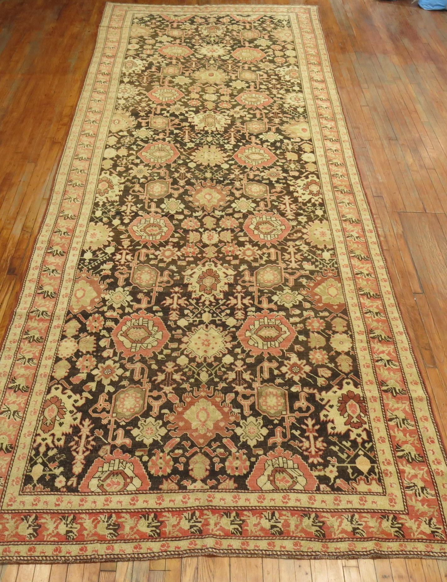 A rare size early 20th century gallery Karabagh rug in predominant soft browns and terracotta accents.

Measures: 6'8